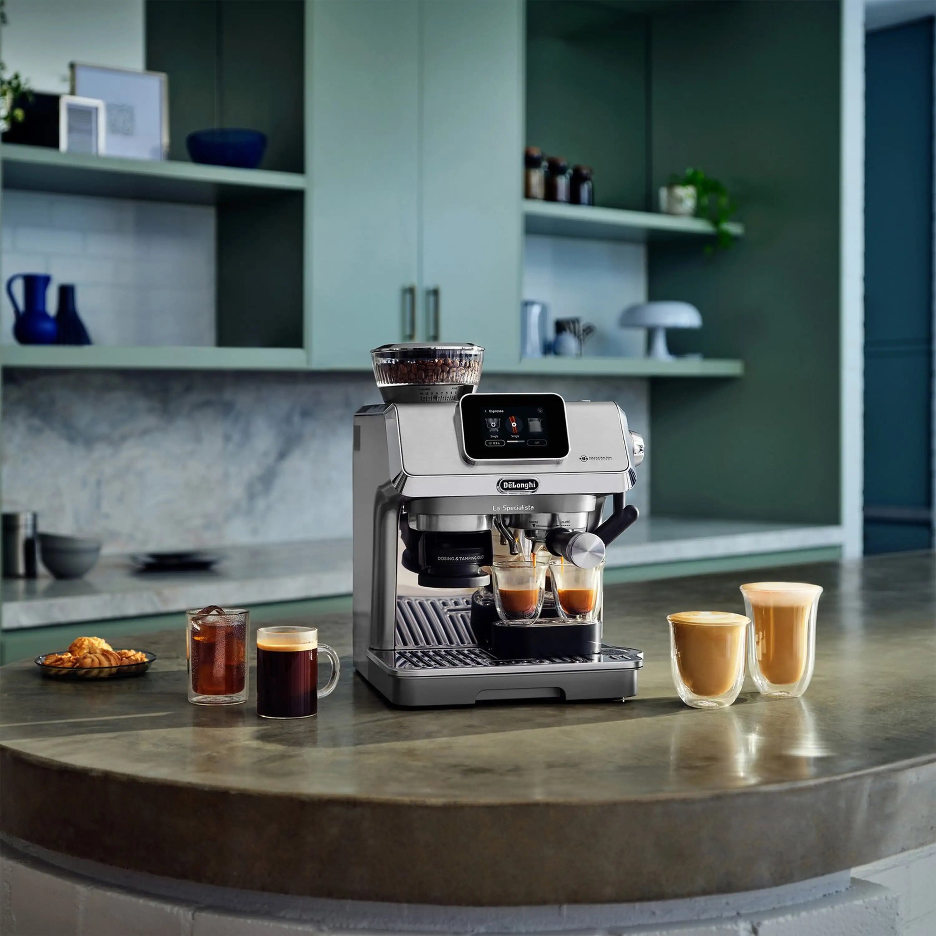 Espresso machine with display and two cups of espresso on the counter