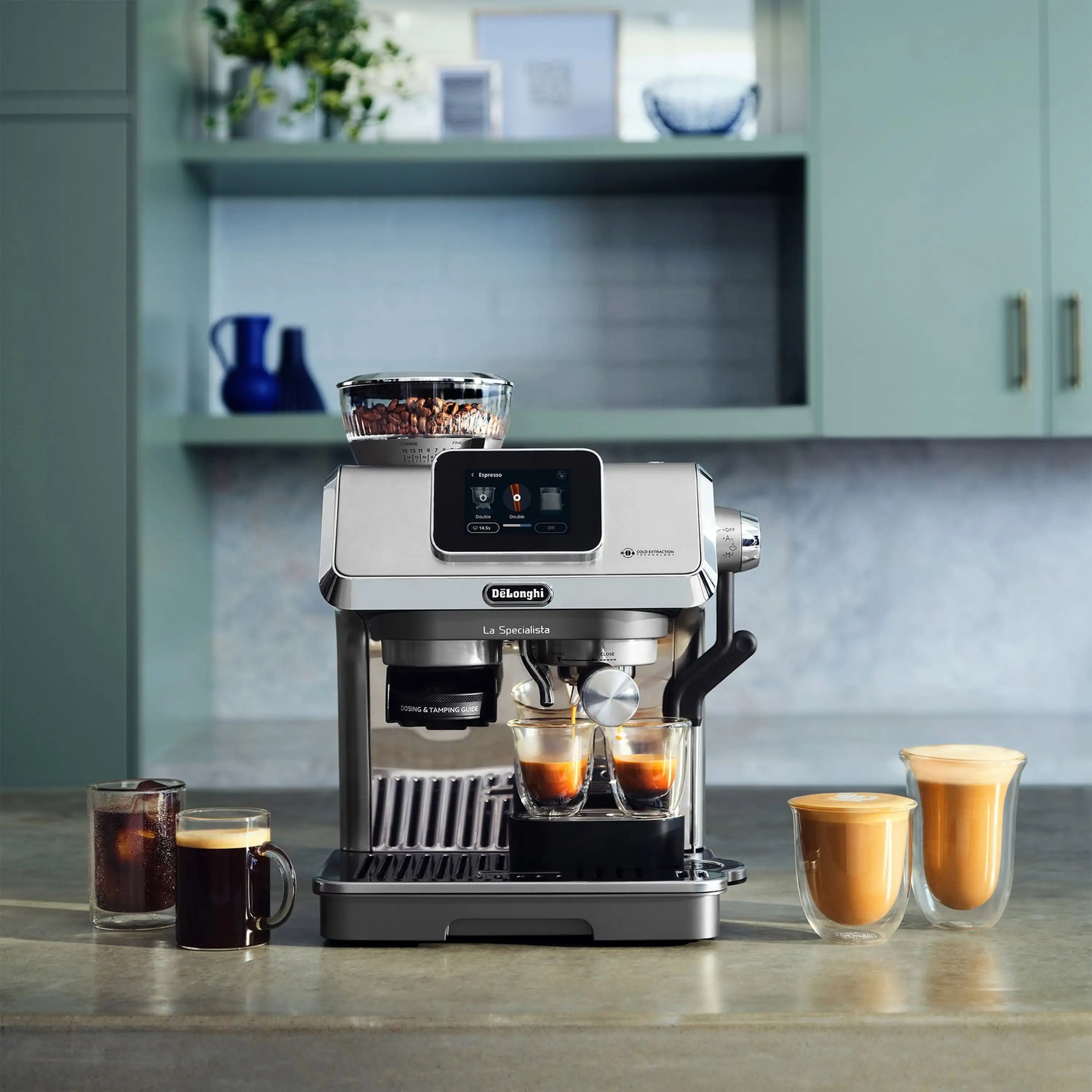 Espresso machine front view dispensing into two cups, with additional coffee cups nearby