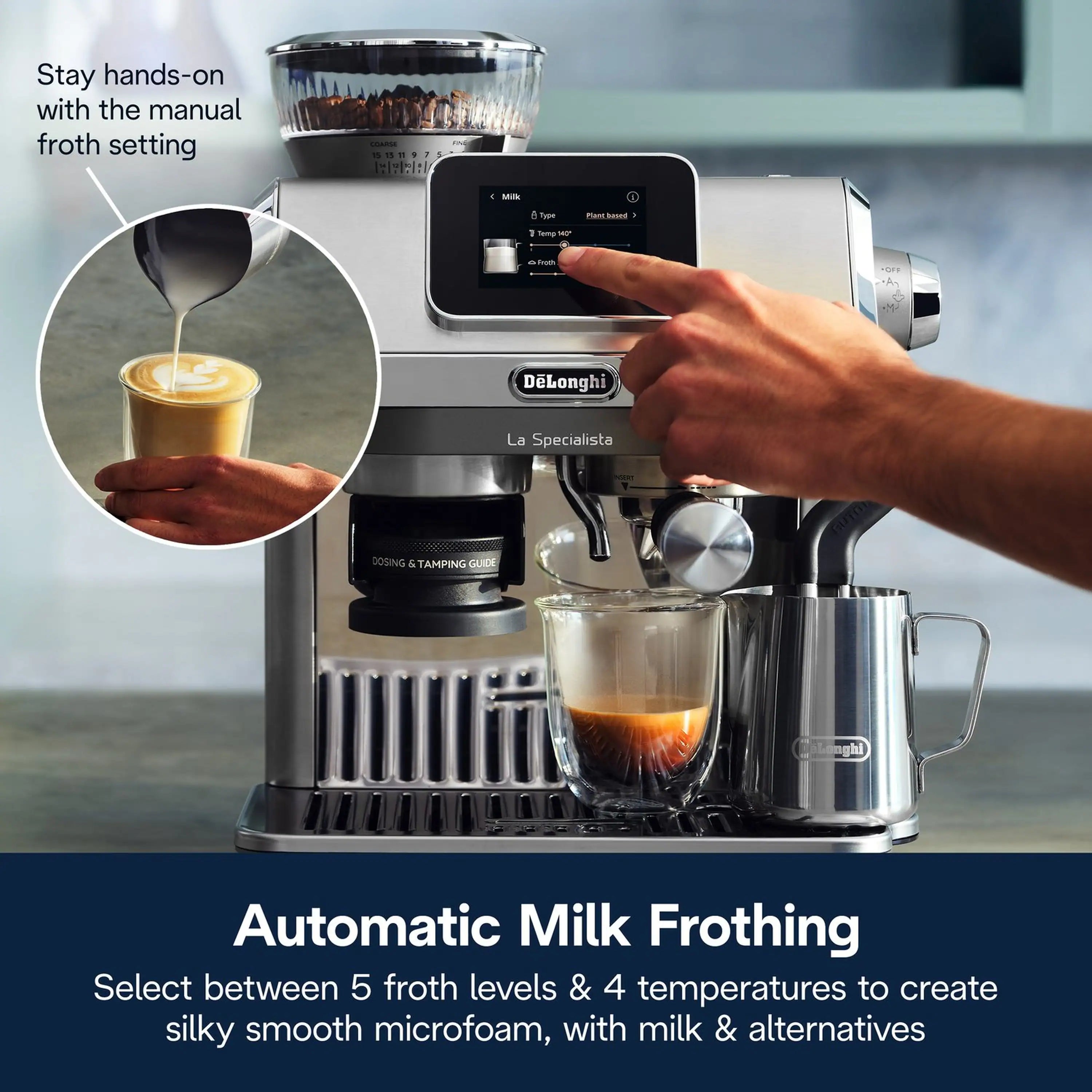 Stainless espresso machine with milk jug filling froth while a hand taps the touchscreen