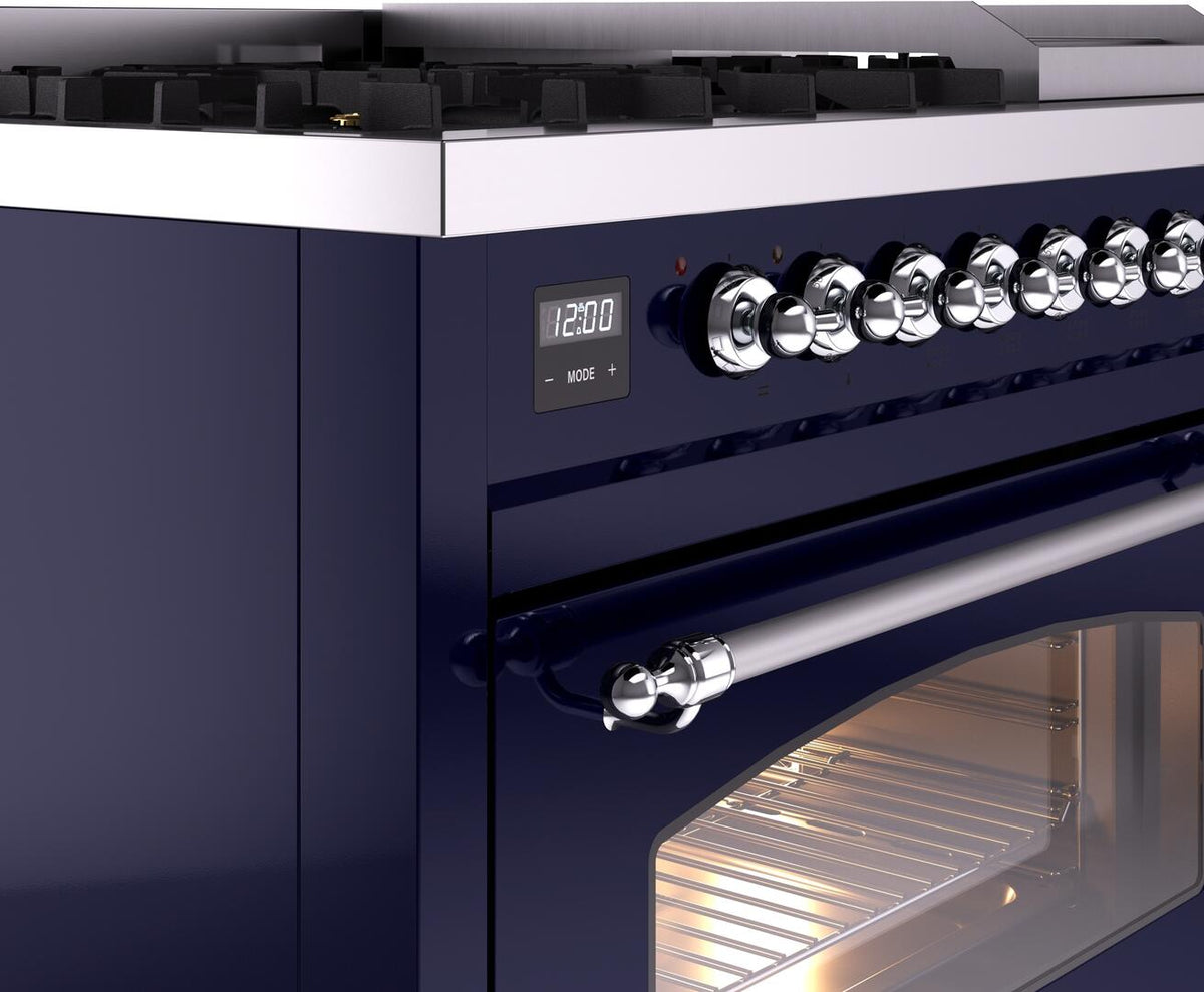 Midnight blue dual fuel gas range control panel with chrome knobs, display, and oven handle
