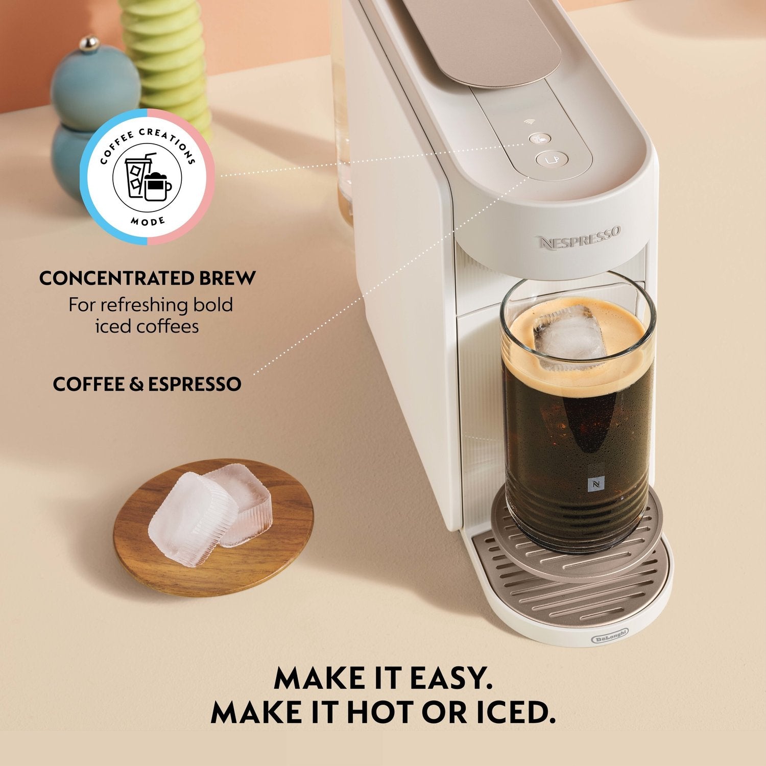 Pearl white Nespresso Vertuo Up machine brewing a coffee cup