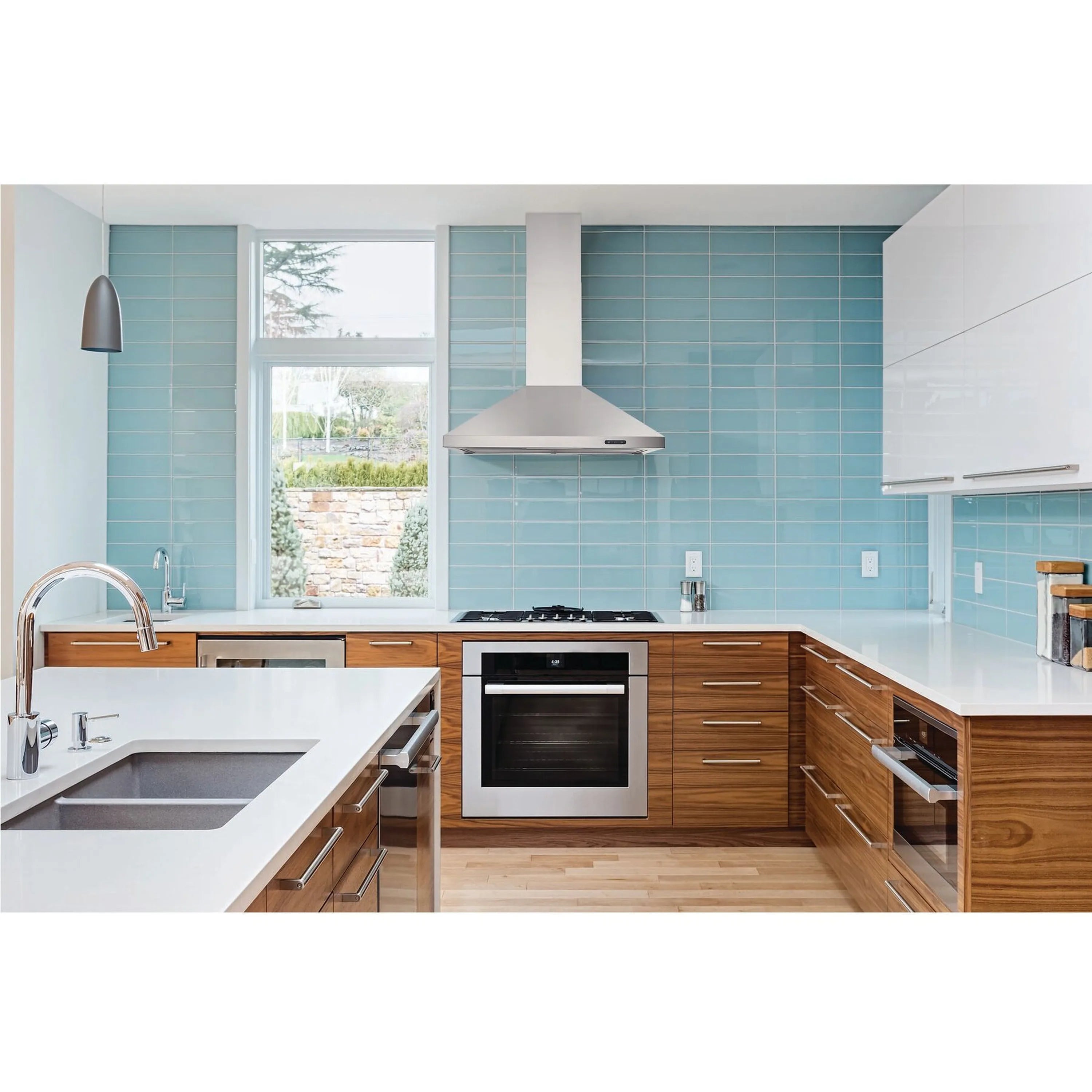Stainless steel pyramidal chimney range hood mounted over the stove