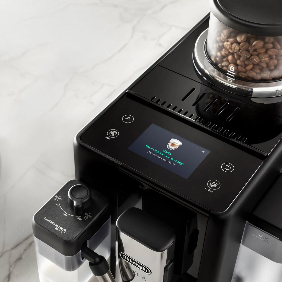 Black espresso machine touchscreen control panel with beverage buttons and spouts