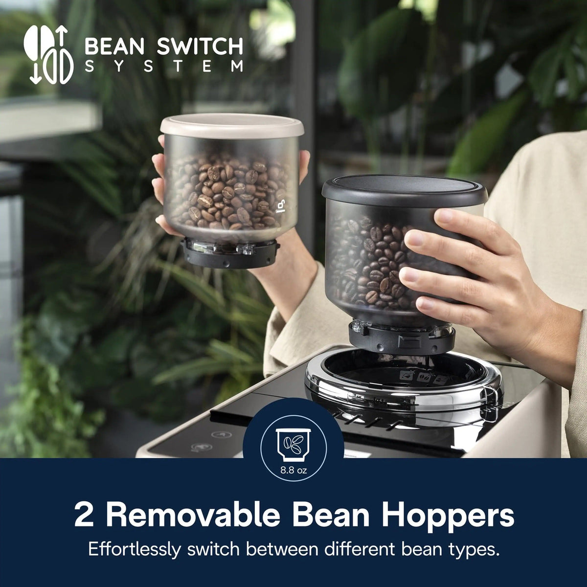 Two removable bean hoppers being swapped on top of an espresso machine