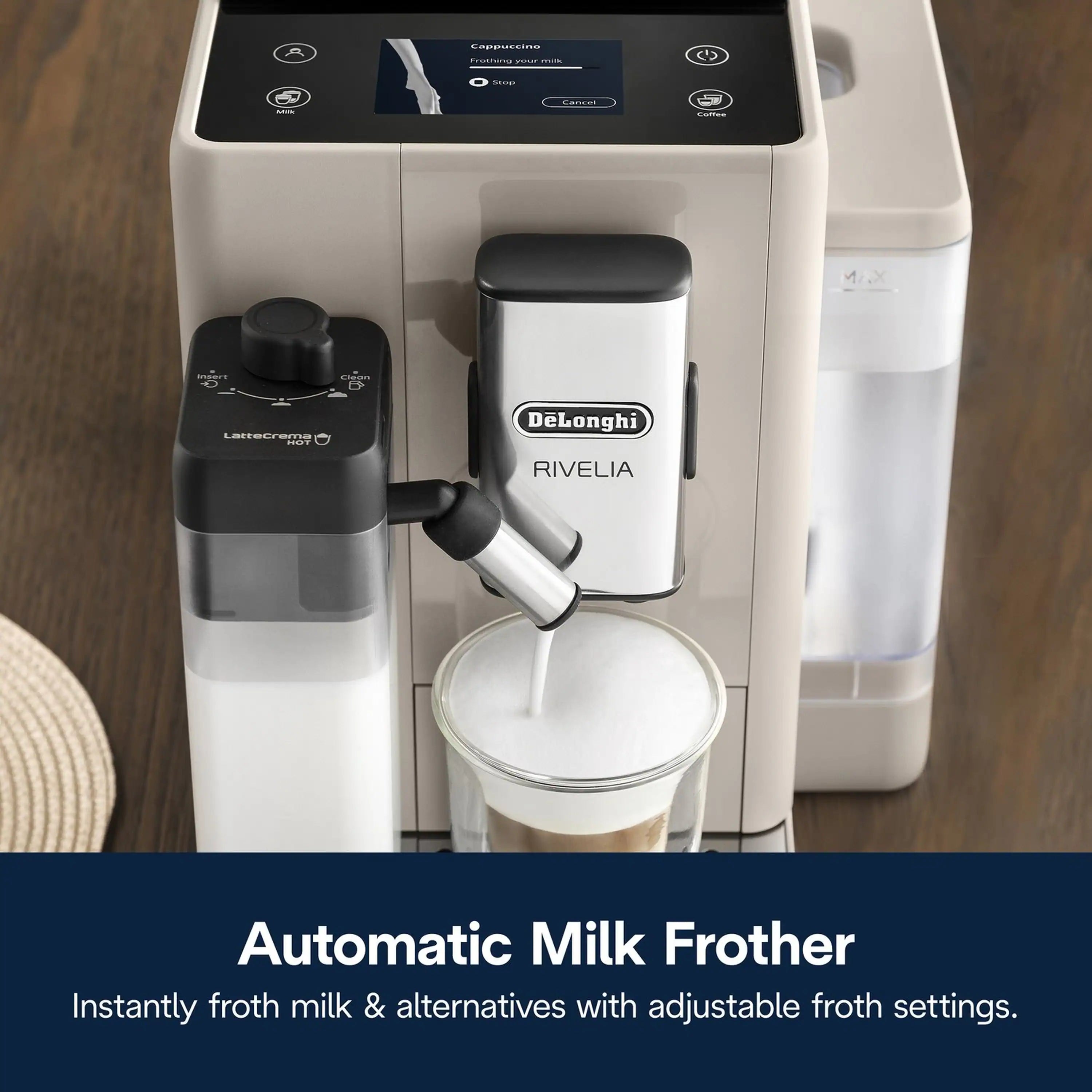 Close-up of milk frother spout and control dial on an automatic espresso machine