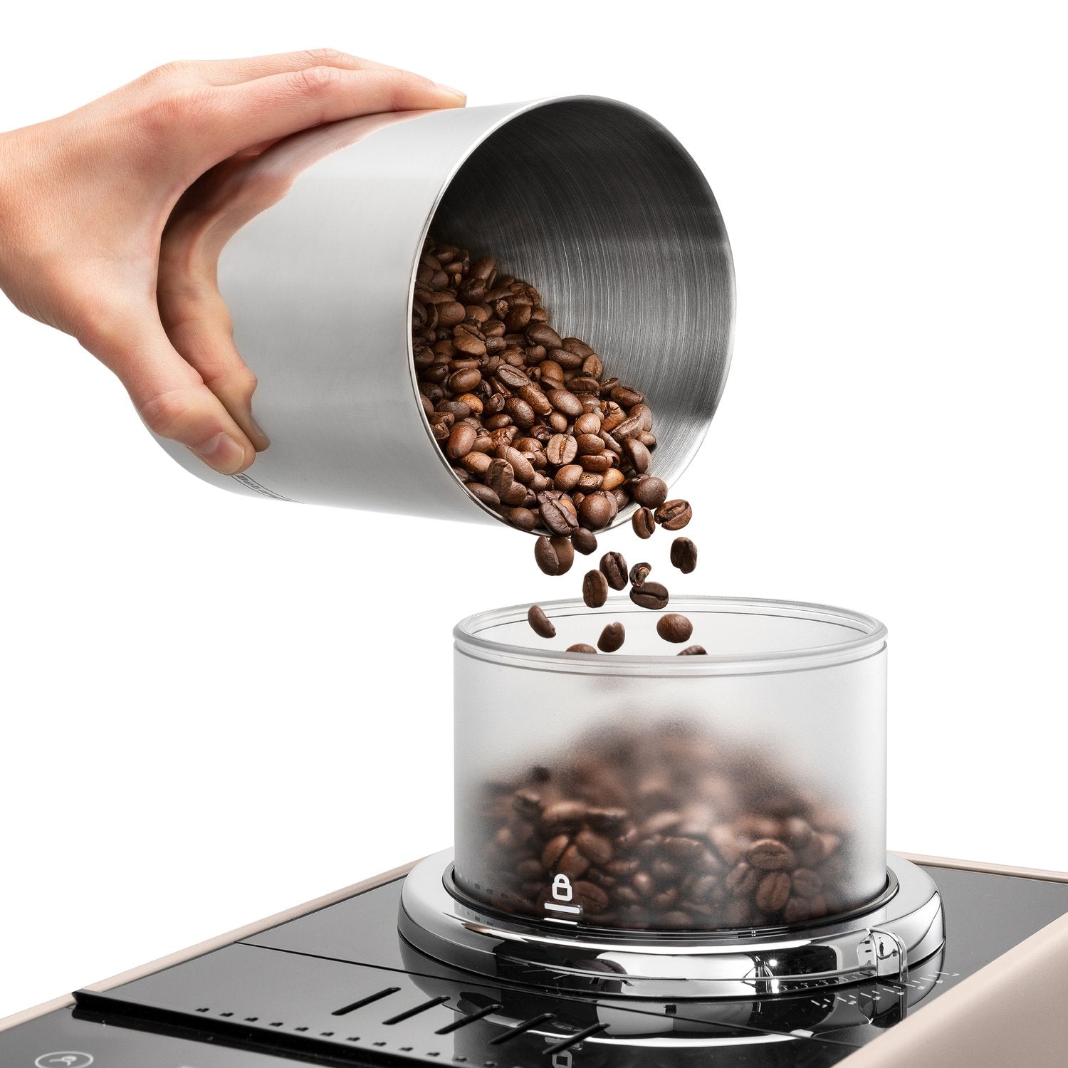 Hand pouring coffee beans into a metal hopper on a beige fully automatic espresso machine