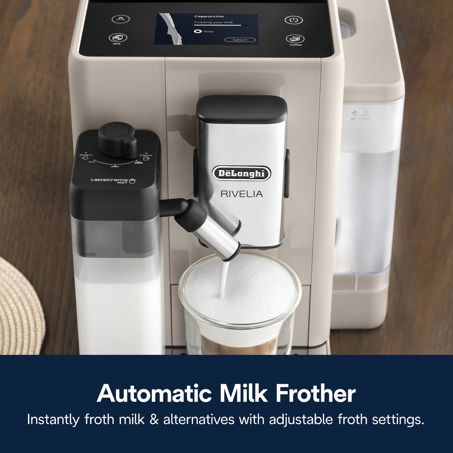 Beige fully automatic espresso machine with steam spout dispensing into a cup