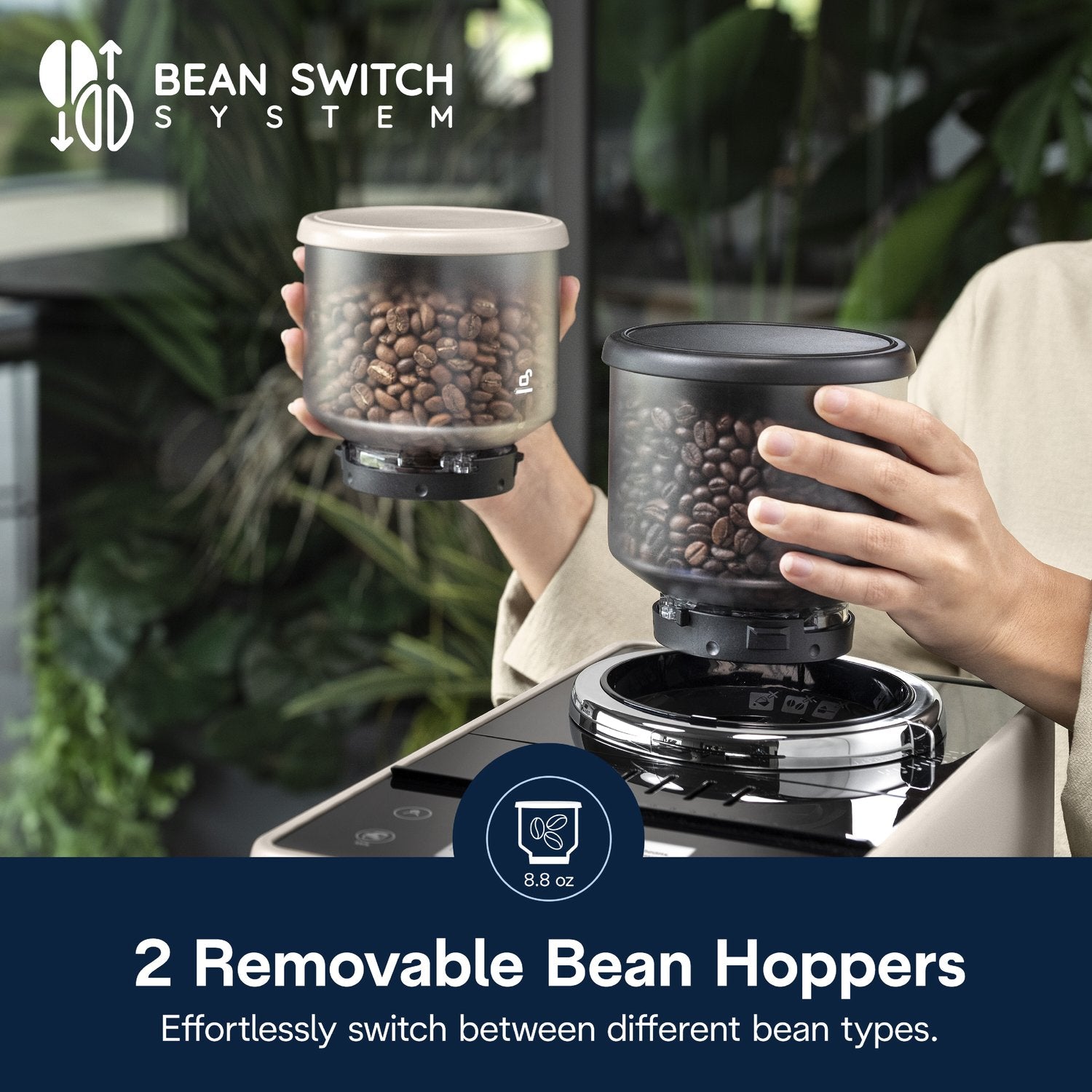 Two removable bean hoppers near a beige espresso machine for switching coffee beans