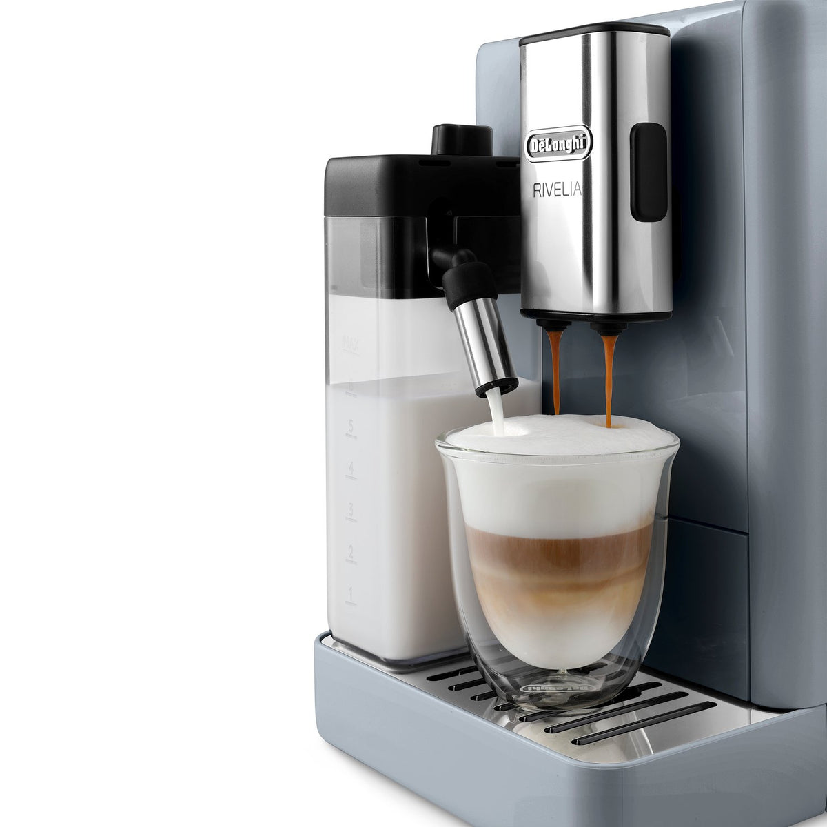 Pebble gray espresso machine dispensing milk into a latte cup with crema