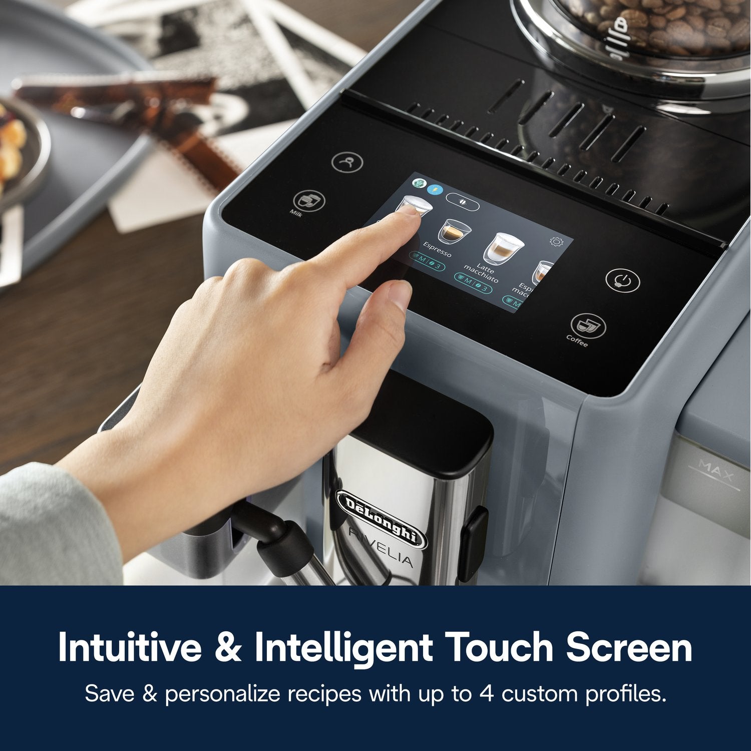 De'Longhi Rivelia espresso machine pebble gray with touch screen and user hand selecting settings