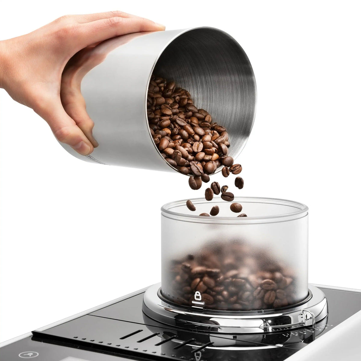 White espresso machine hopper pouring coffee beans into clear container