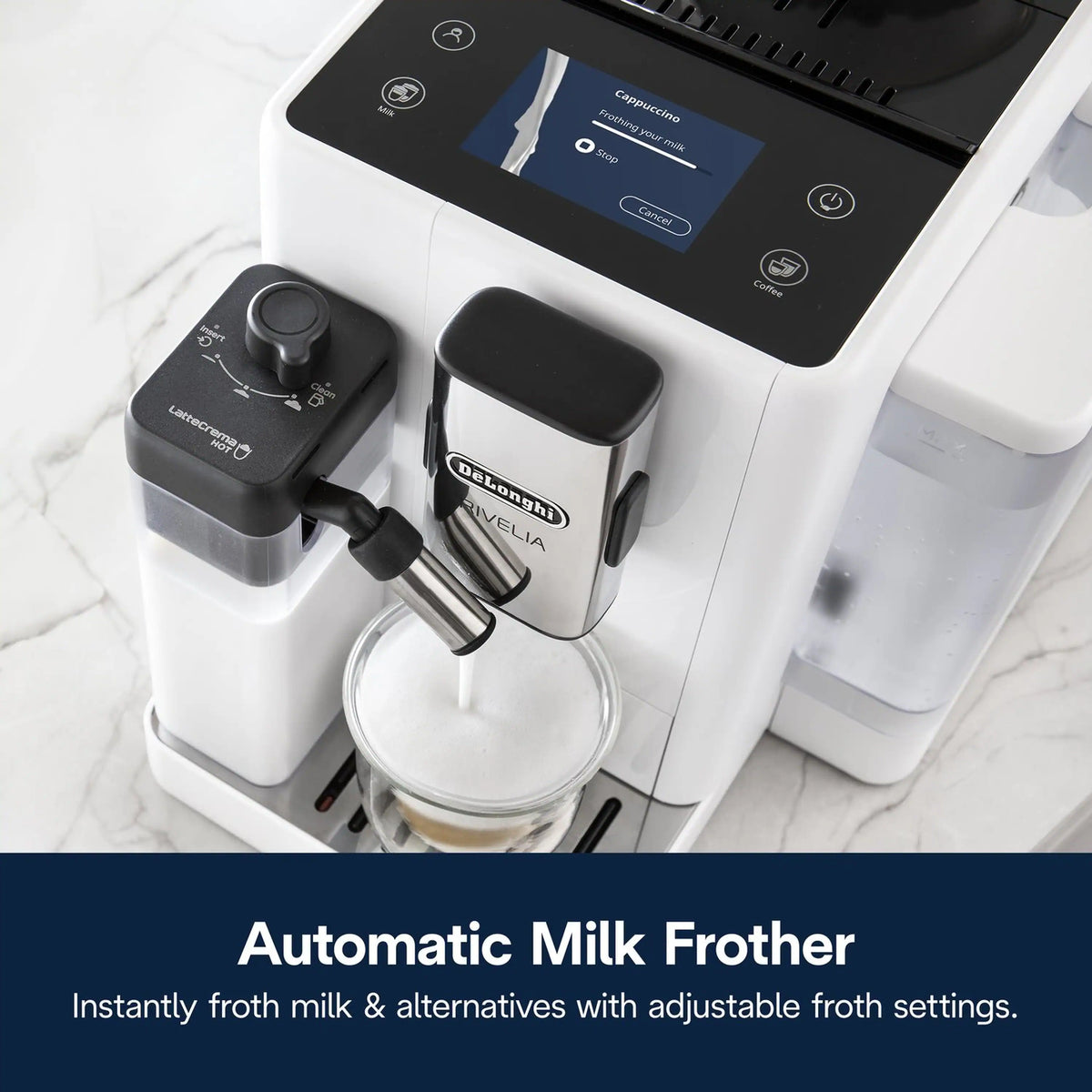 Automatic milk frother on white espresso machine with glass under the dispensing spout