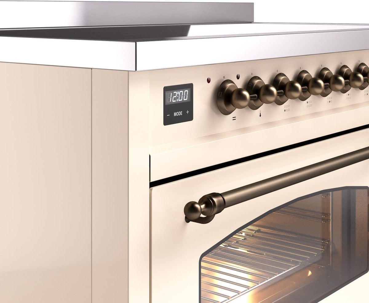 Freestanding electric induction range control panel with digital display and bronze knobs