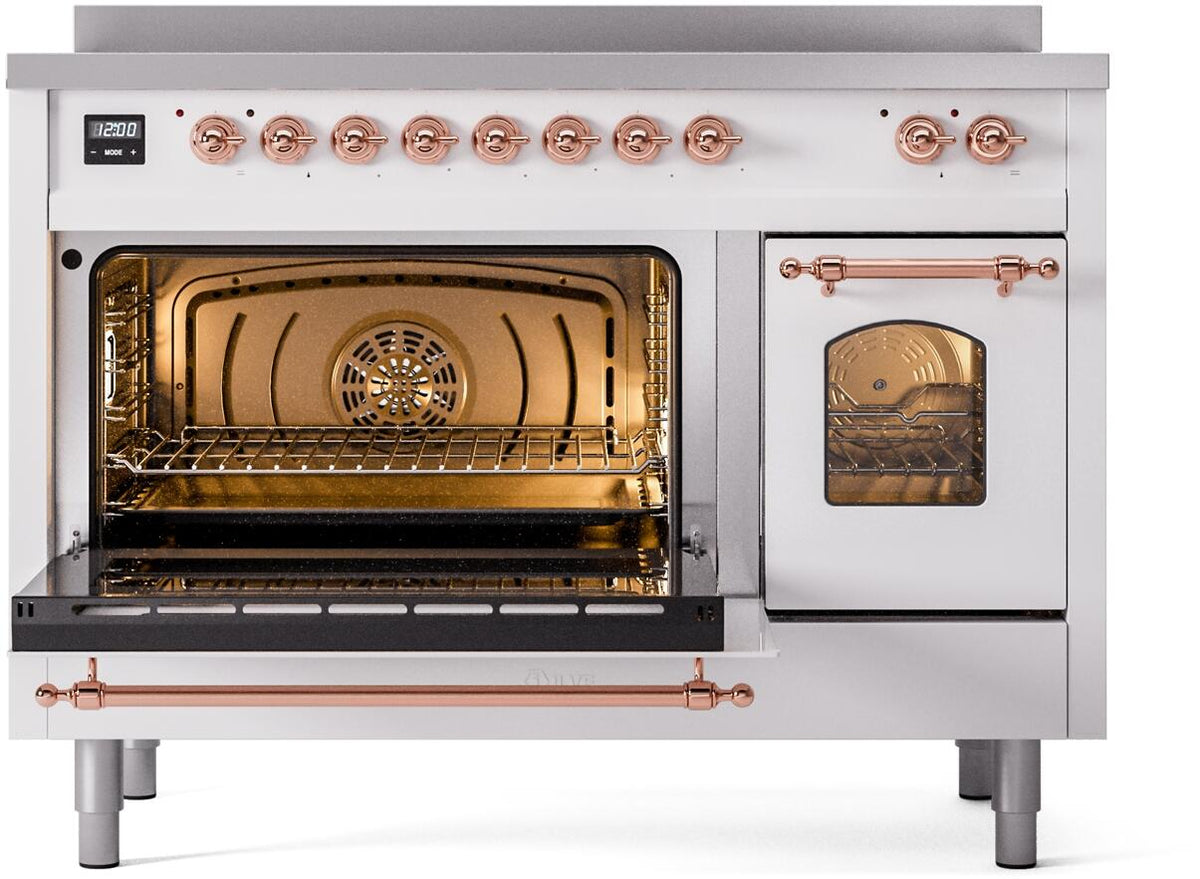 White freestanding induction range with open ovens, copper handles, and lit interior