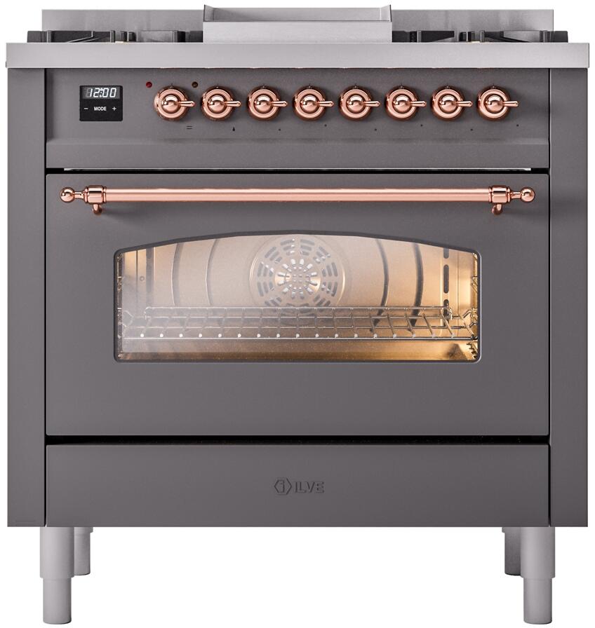 Freestanding dual fuel range front with copper control knobs and frosted oven door window