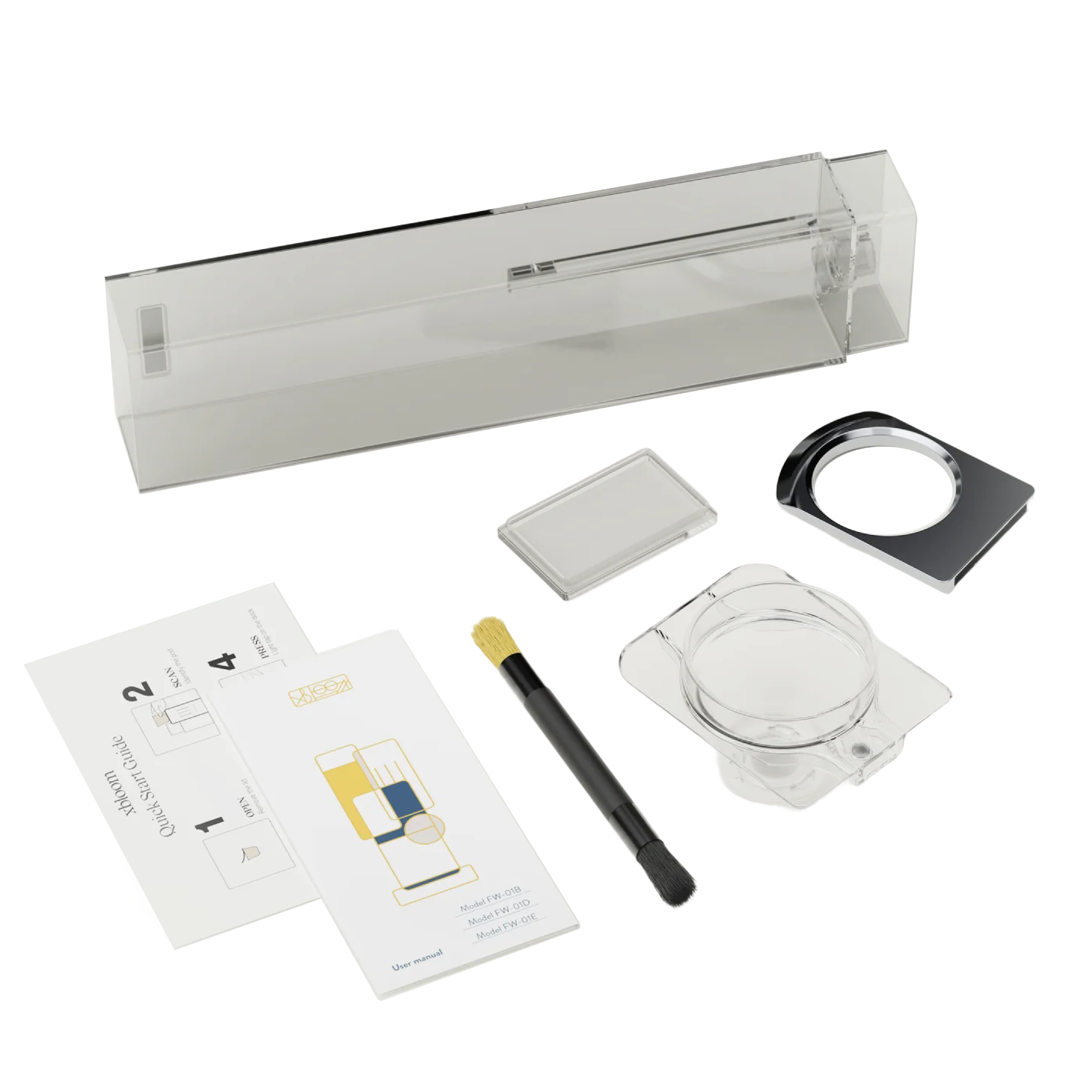 Coffee maker accessories kit with power adapter, manual, glass carafe, and measuring tool.