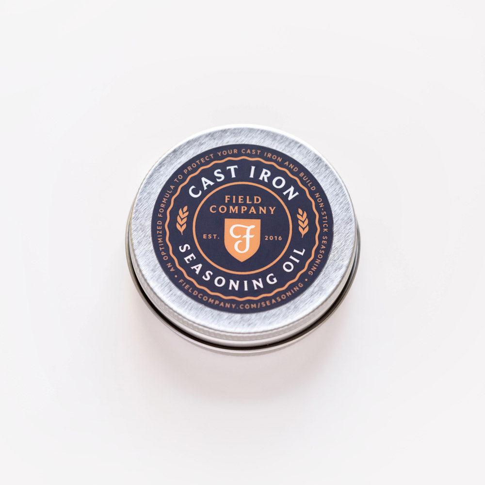 Round metal tin labeled Cast Iron Seasoning