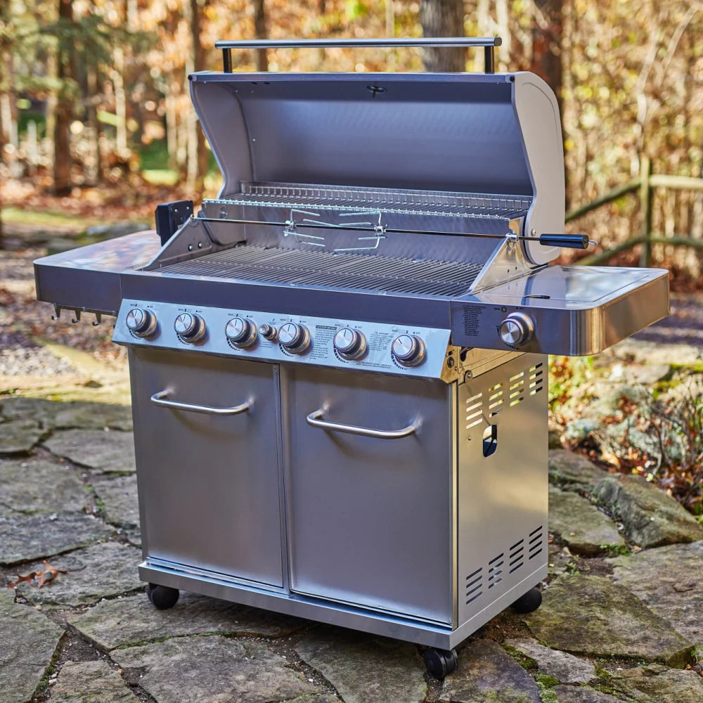 Front view stainless steel propane grill with open hood, burner knobs, and side shelf