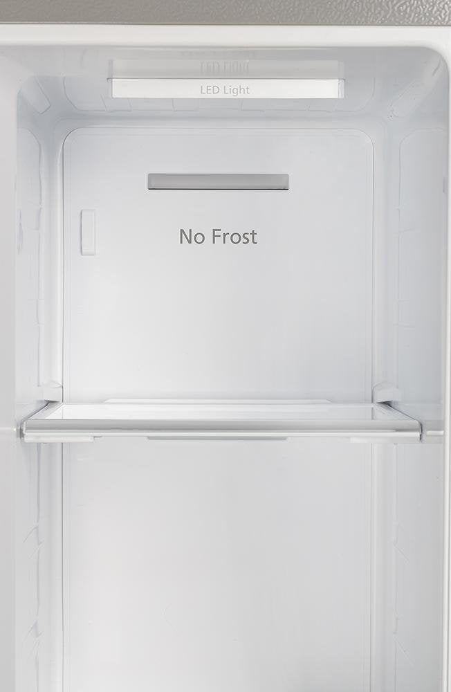 Refrigerator freezer interior with “No Frost” panel and LED light above