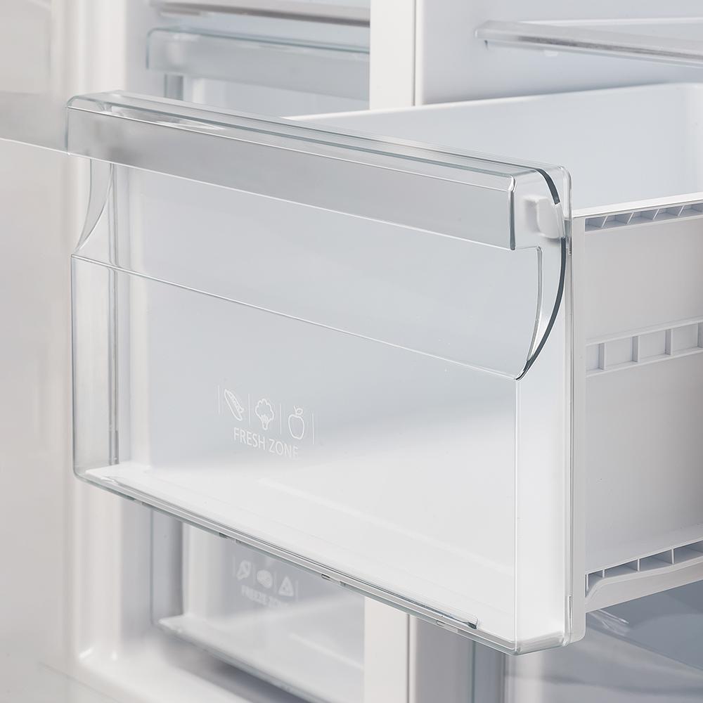 Clear refrigerator drawer on rails with front panel labeled “FRESH”
