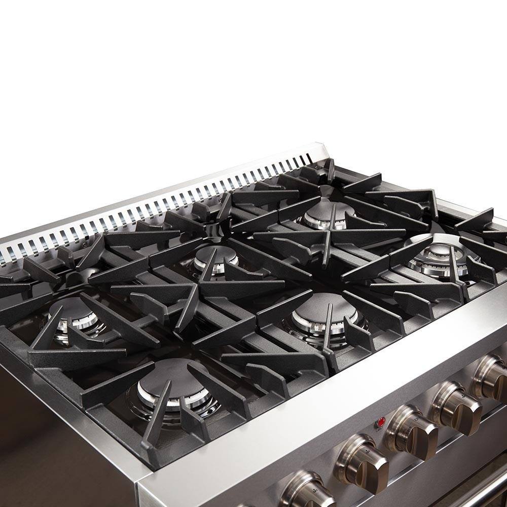 Dual fuel range cooktop close-up with black grates and centered burner head