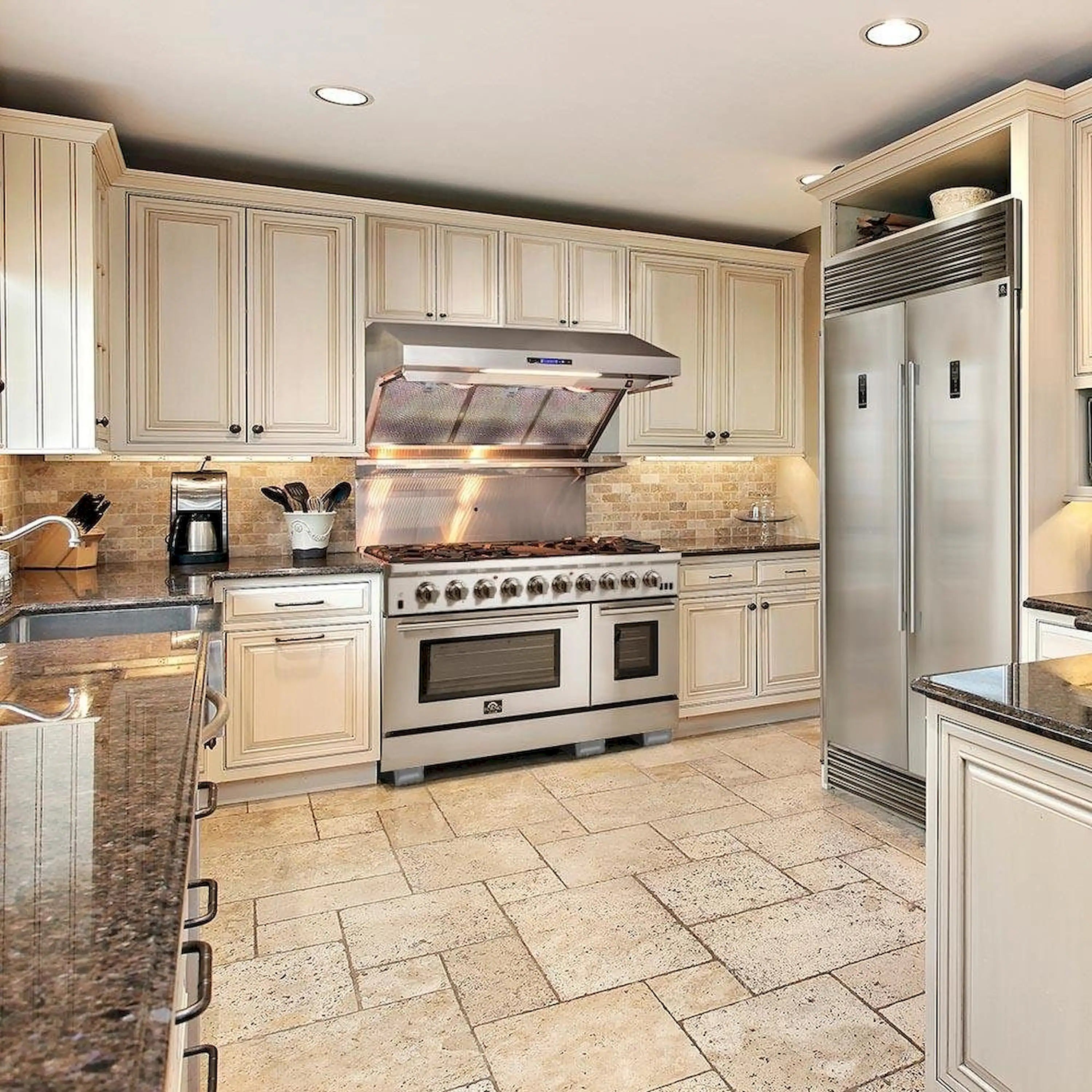 Stainless steel gas range with wall-mounted hood over the cooktop