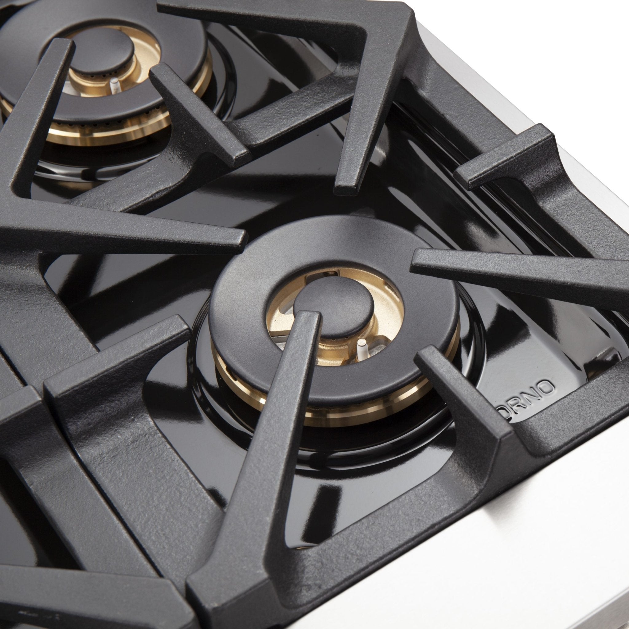 Close-up of dual-ring gas burner on black cast-iron grate