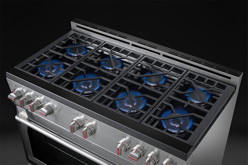 Stainless steel gas cooktop with multiple burners and control knobs