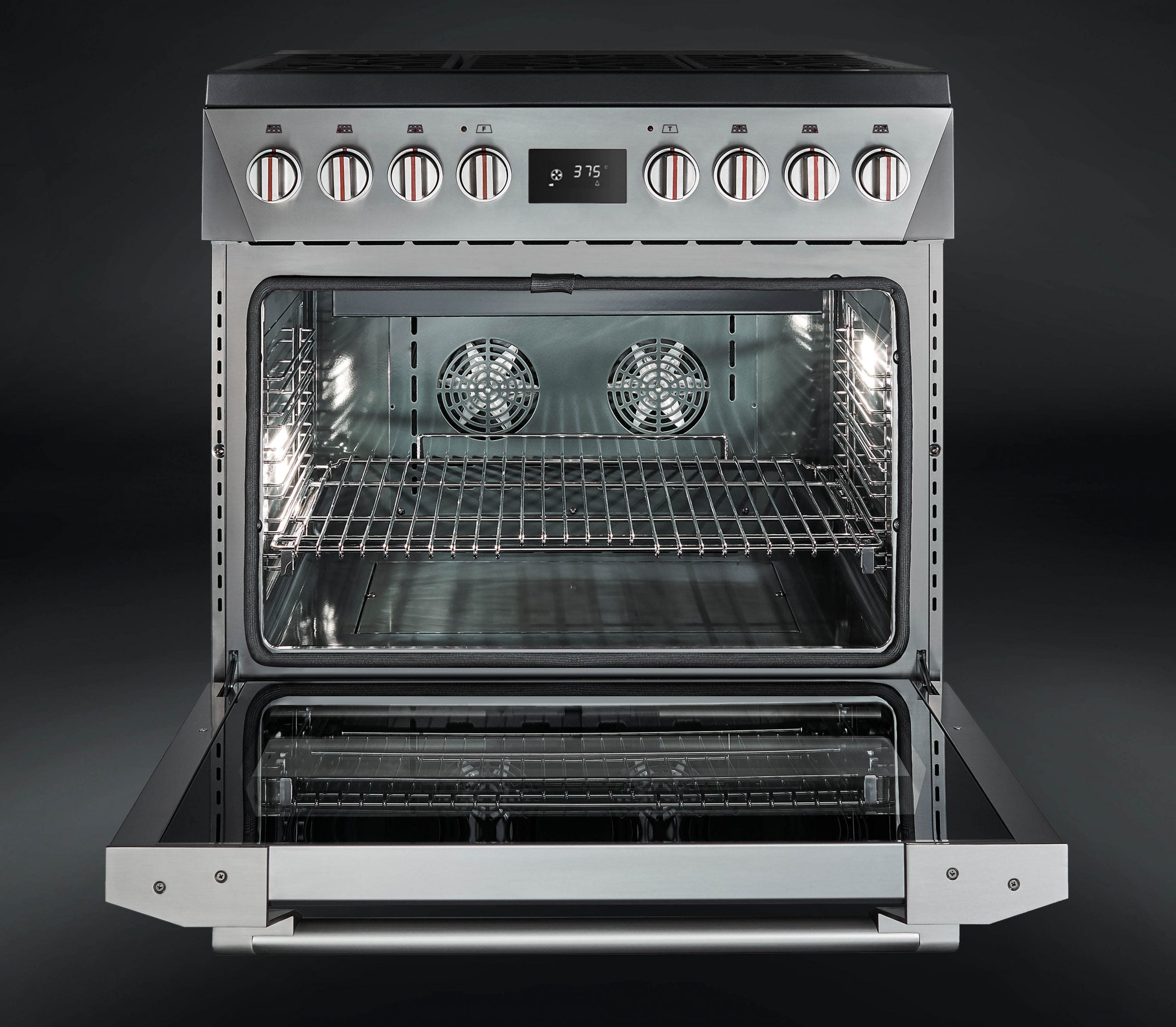 Open oven cavity with two convection fans and upper heating elements