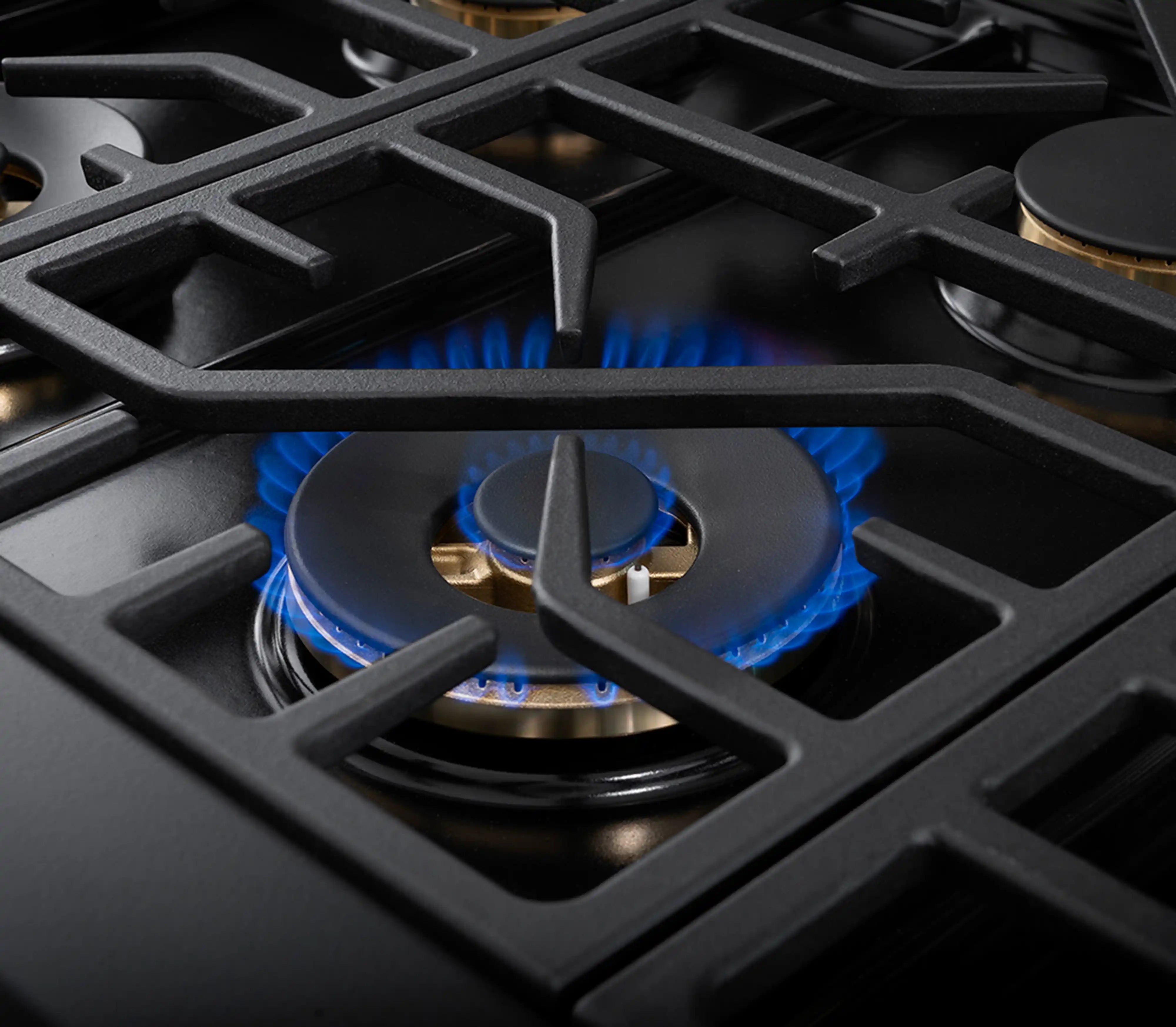 Dual fuel range burner with blue gas flame under cast-iron grate