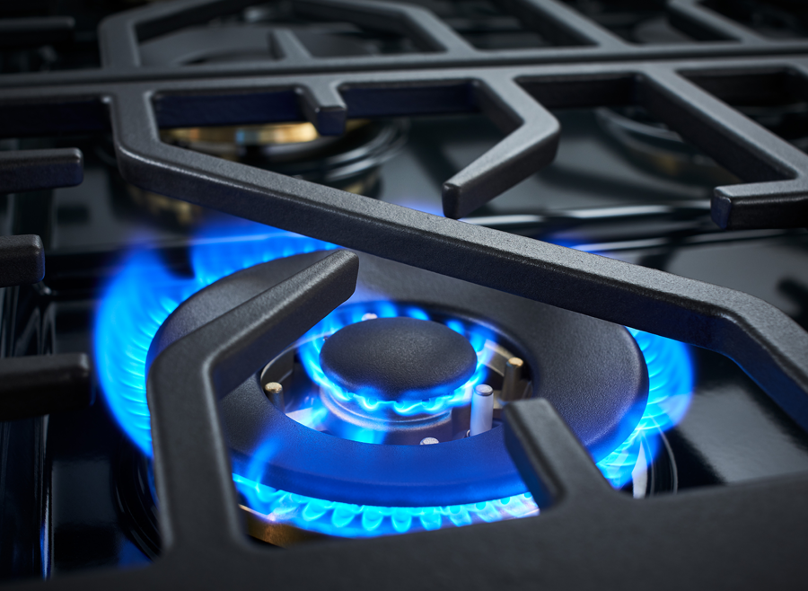 30-inch dual fuel range burner with blue gas flame under black grate