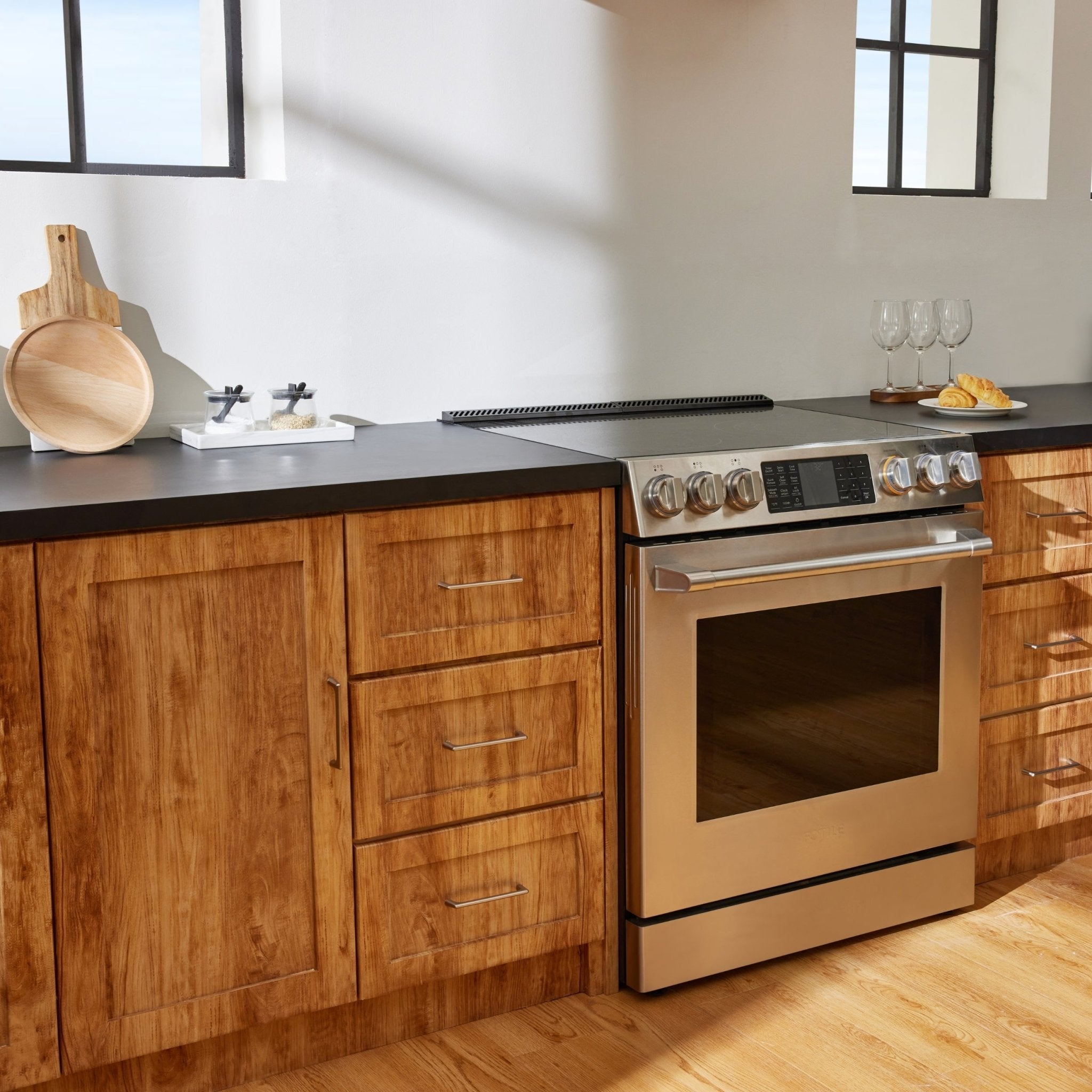 Stainless steel slide-in electric range with oven door and control panel