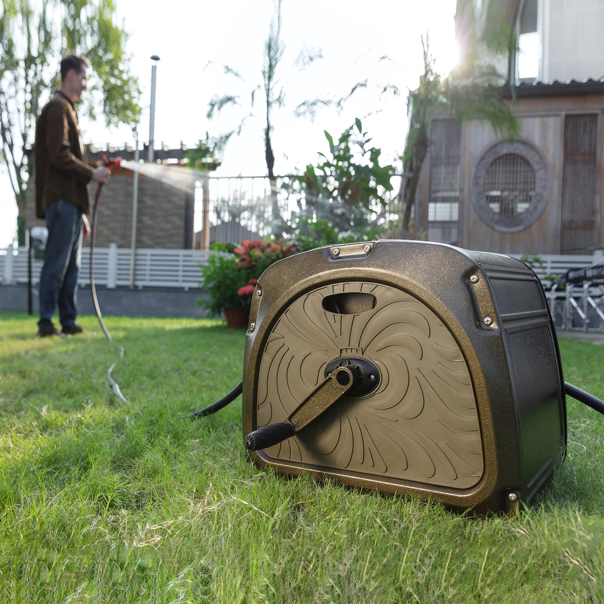 Garden hose reel box on lawn with hose feeding from the front outlet