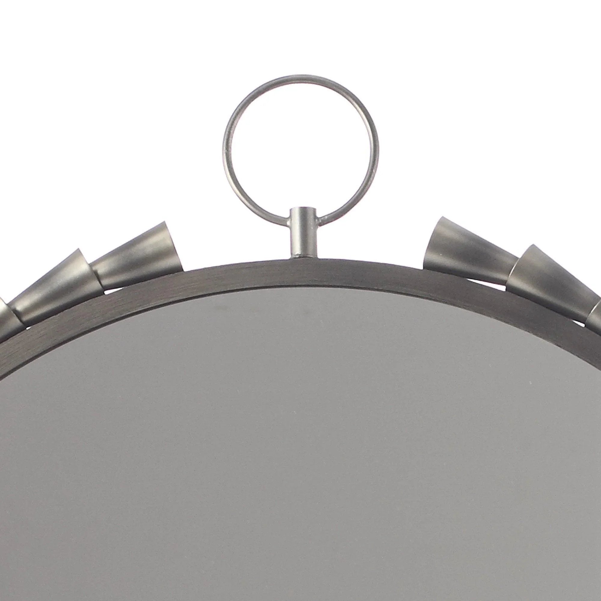 Close-up of grey round wall mirror rim with hanging loop