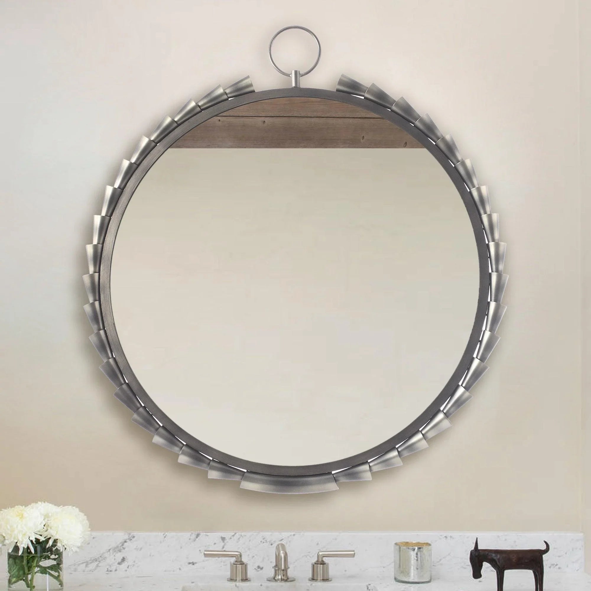 Round grey wall mirror with metallic tab frame and hanging ring