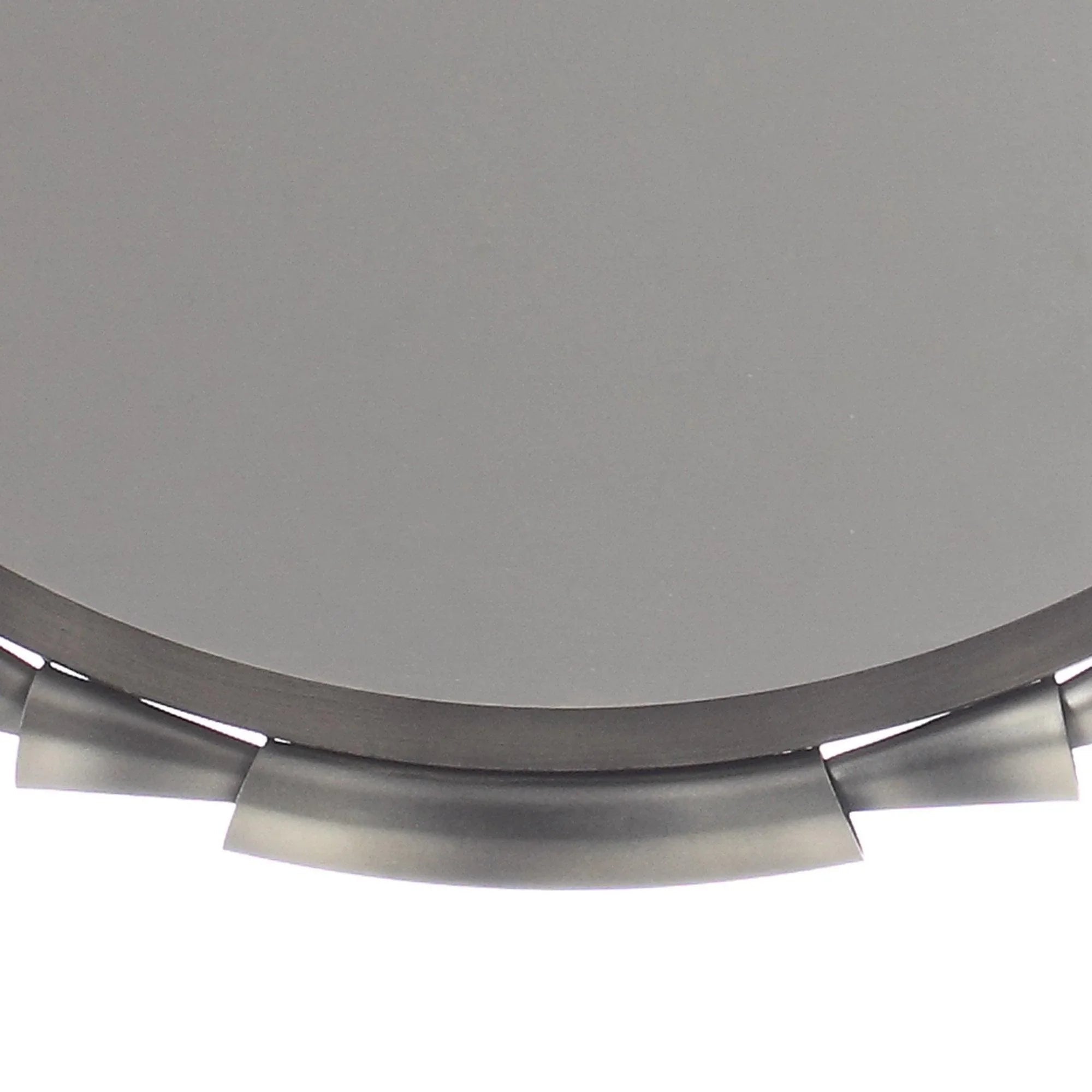 Grey round wall mirror lower edge with metallic tab accent