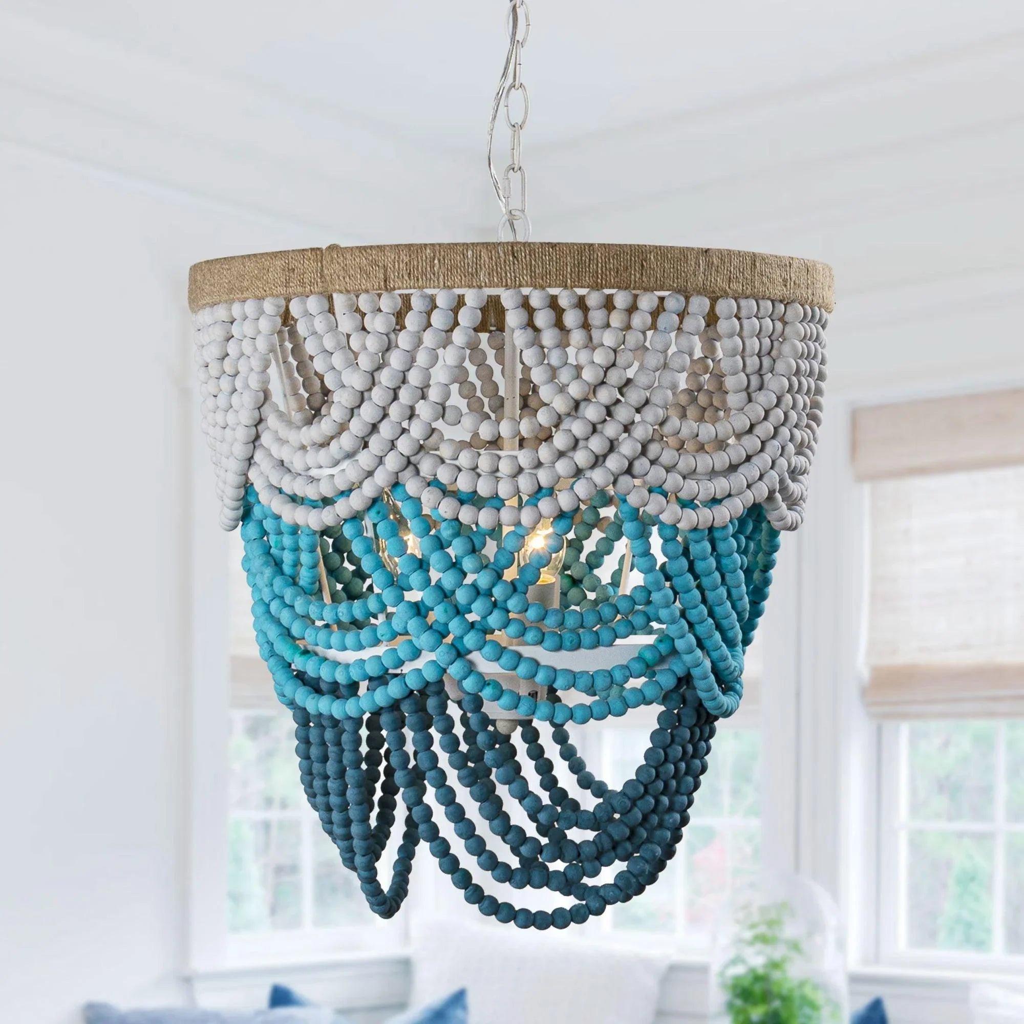 Turquoise and white beaded bohemia chandelier hanging from a metal chain