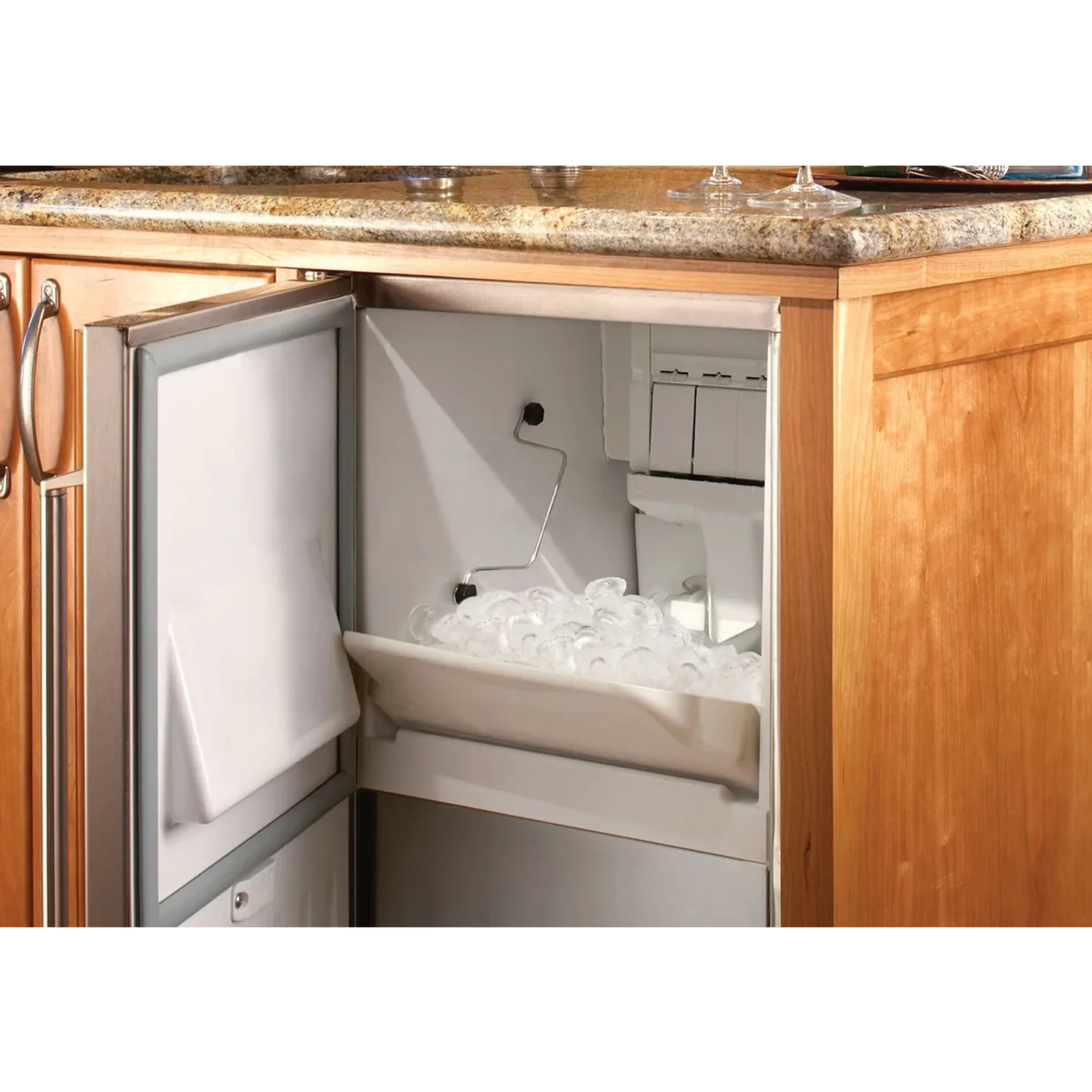 Clear ice maker with door open showing interior ice storage bin and components