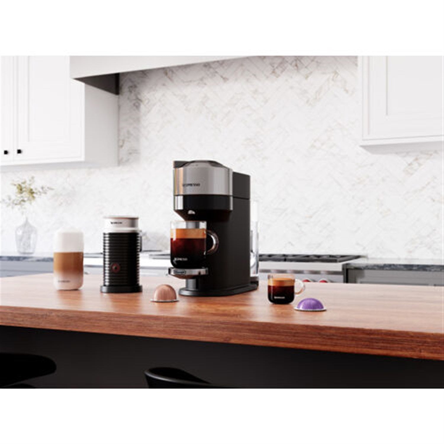 Chrome Nespresso Vertuo Next coffee maker with black base and Aeroccino milk frother