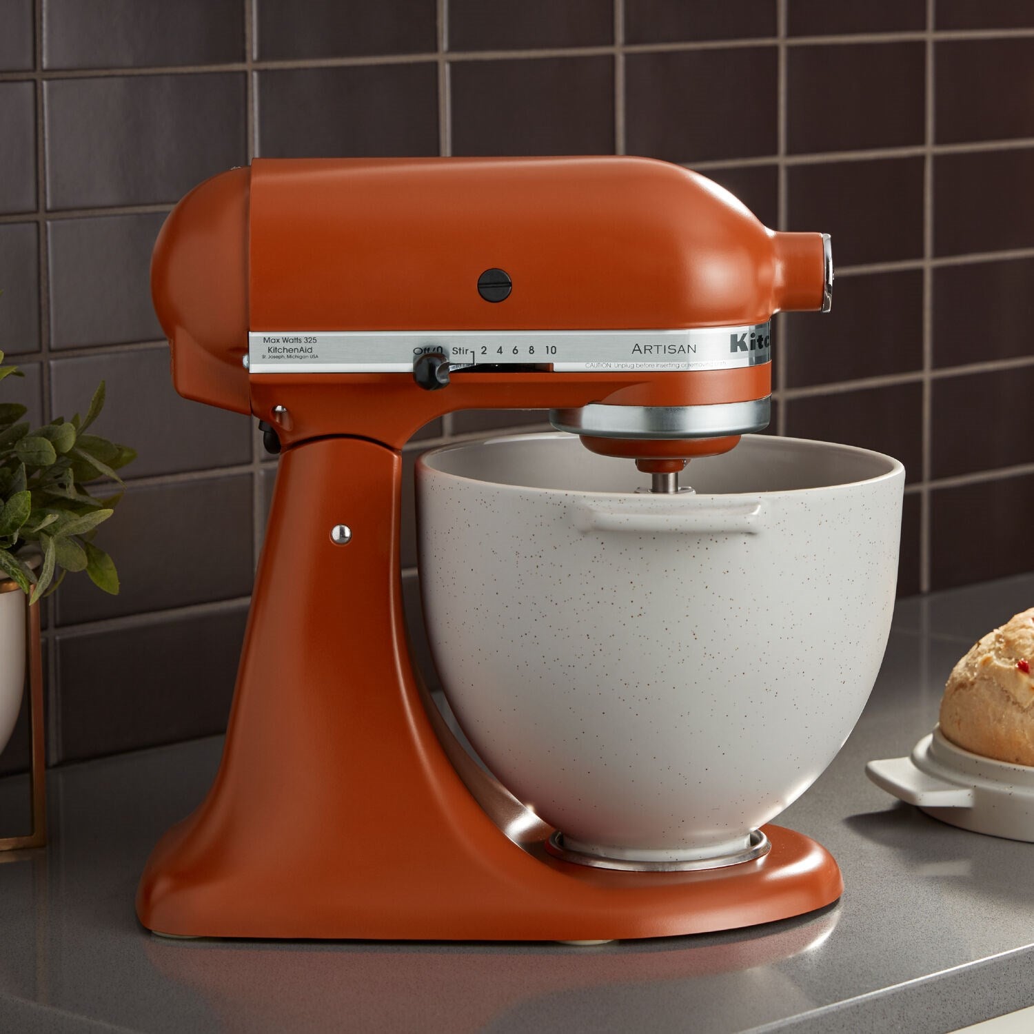 Scorched orange KitchenAid Artisan tilt-head stand mixer with white-speckled bowl