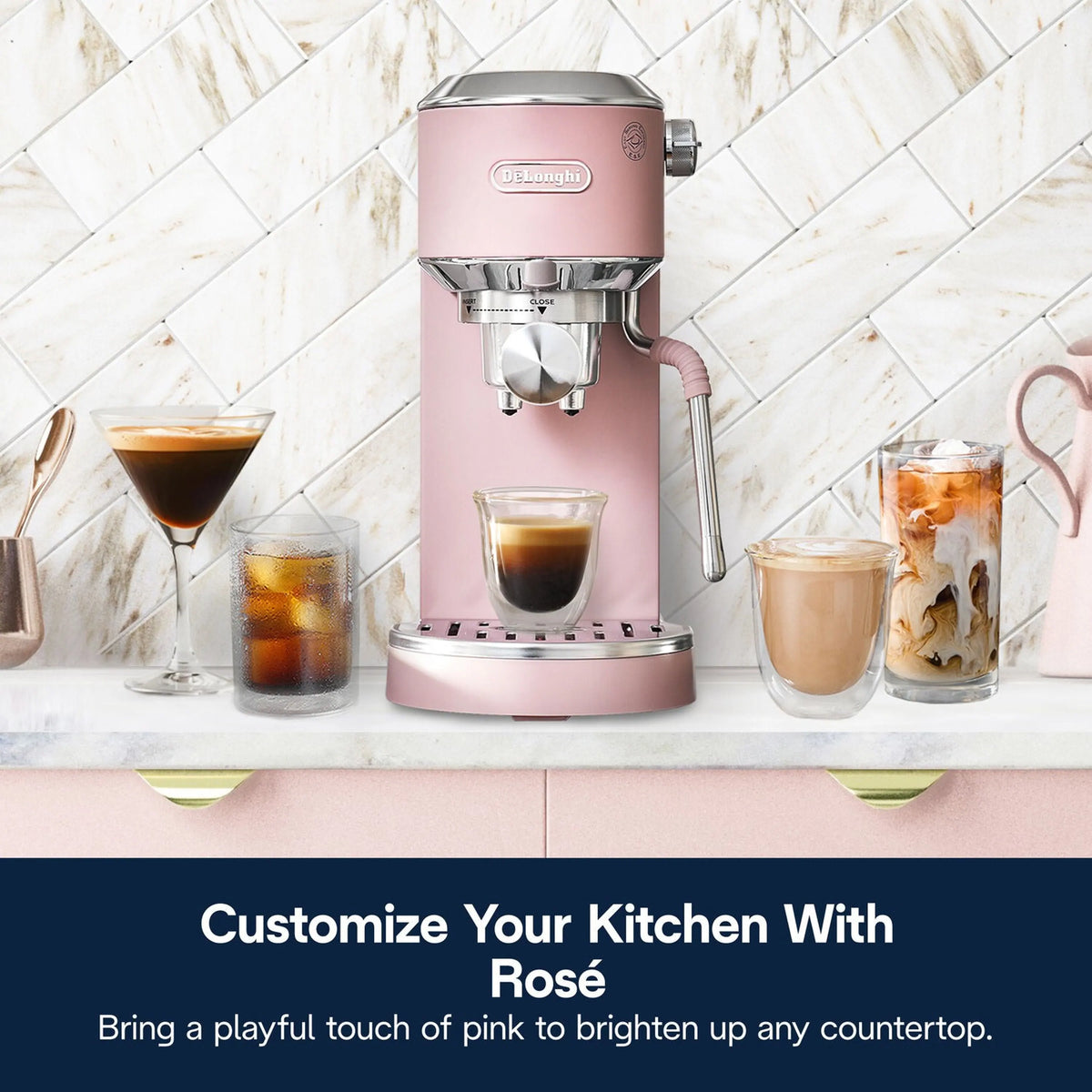 Pink De'Longhi espresso machine with frothing wand and hot and iced coffee cups