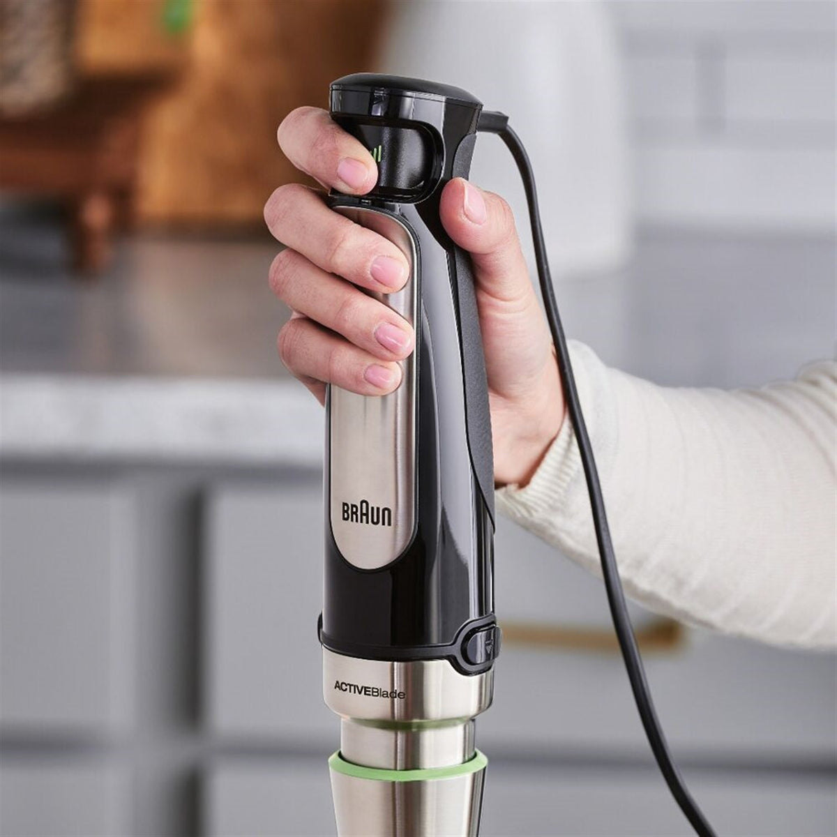 Braun handheld immersion blender in black and stainless steel, with power cord