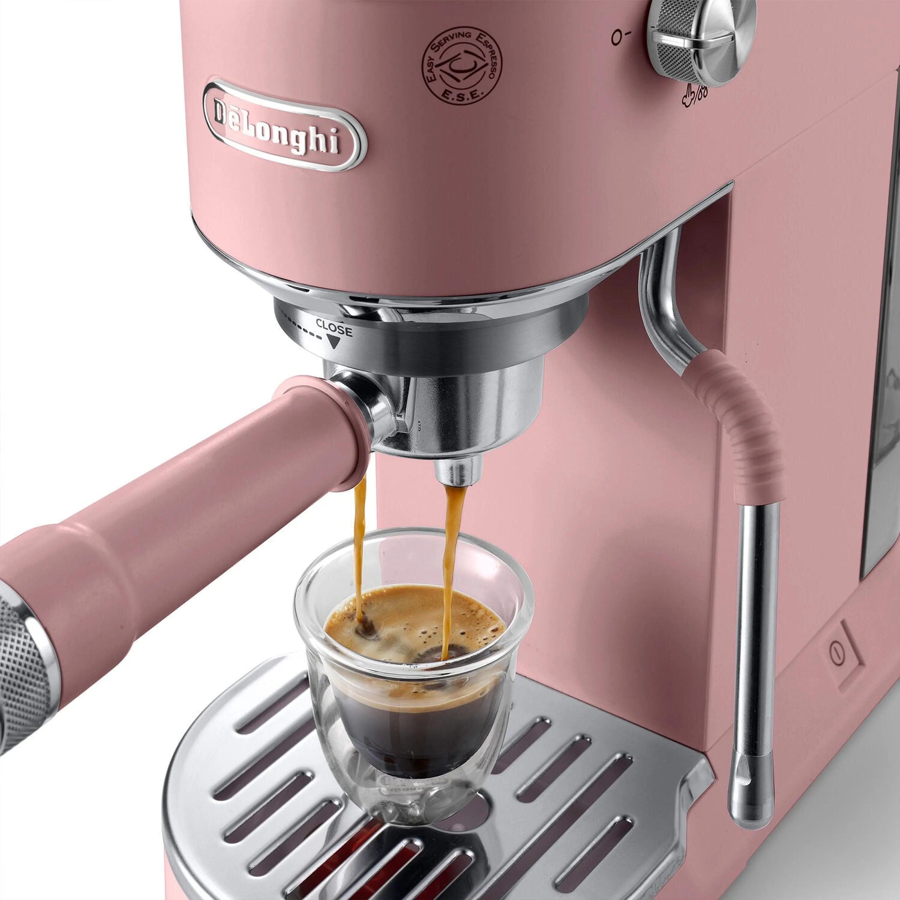 Pink De'Longhi pump espresso machine pouring into a cup with pink frothing wand