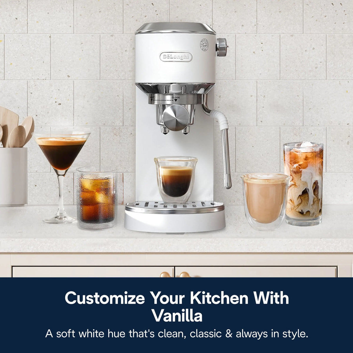 White and stainless espresso machine on counter with multiple coffee cups and glass carafe