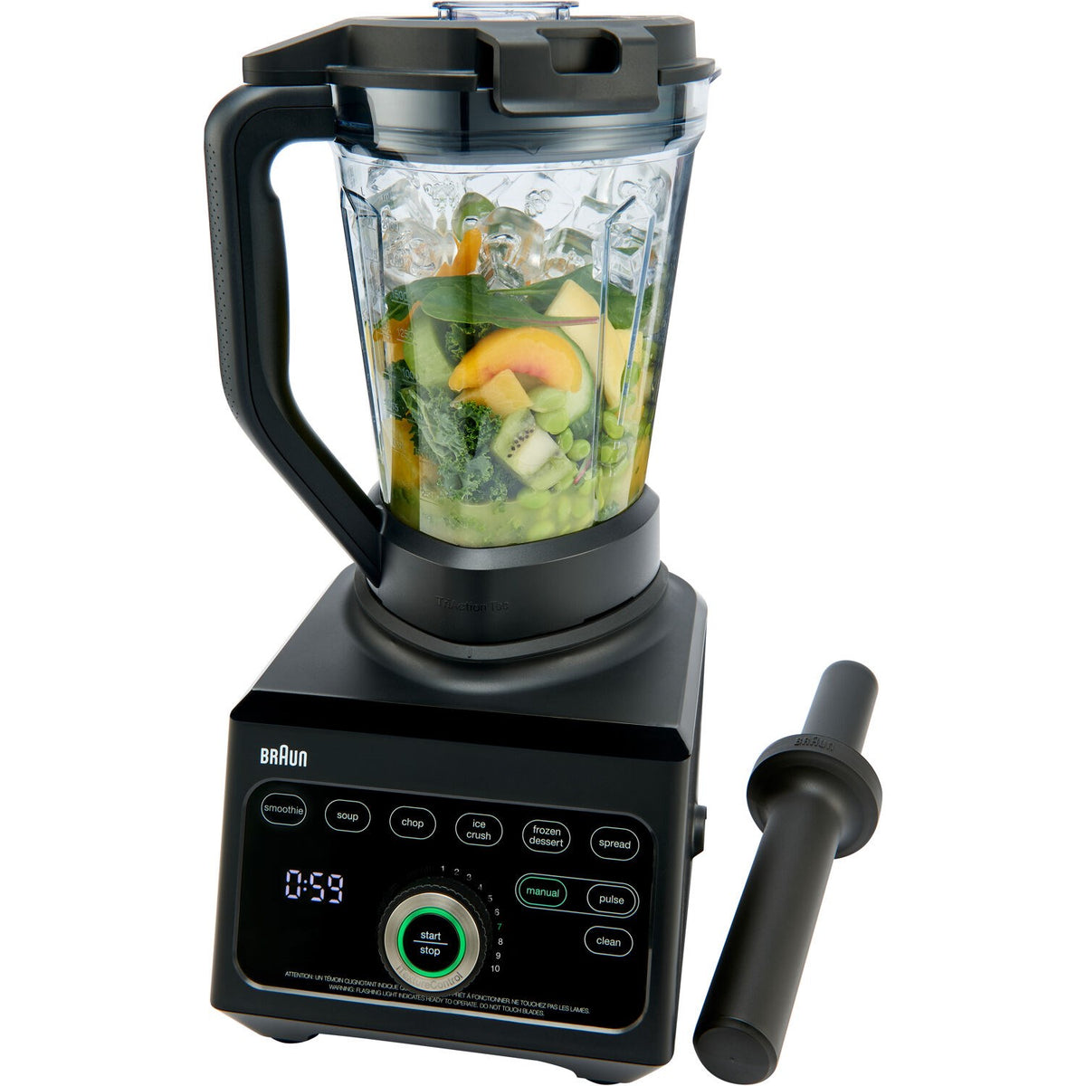 Black countertop blender with clear jar holding chopped vegetables and fruit