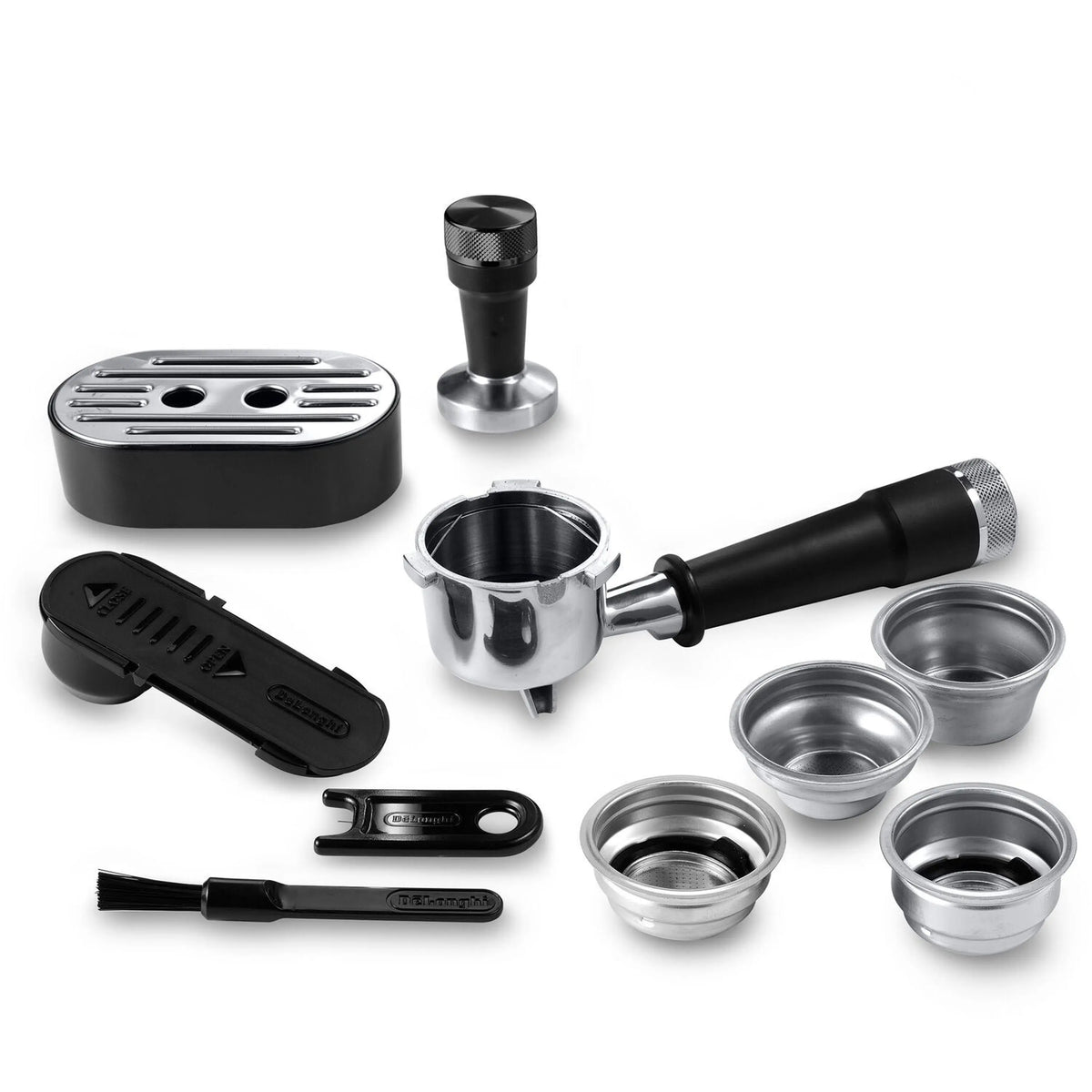 Espresso machine accessories set: portafilter, steam wand nozzle, and metal filter baskets