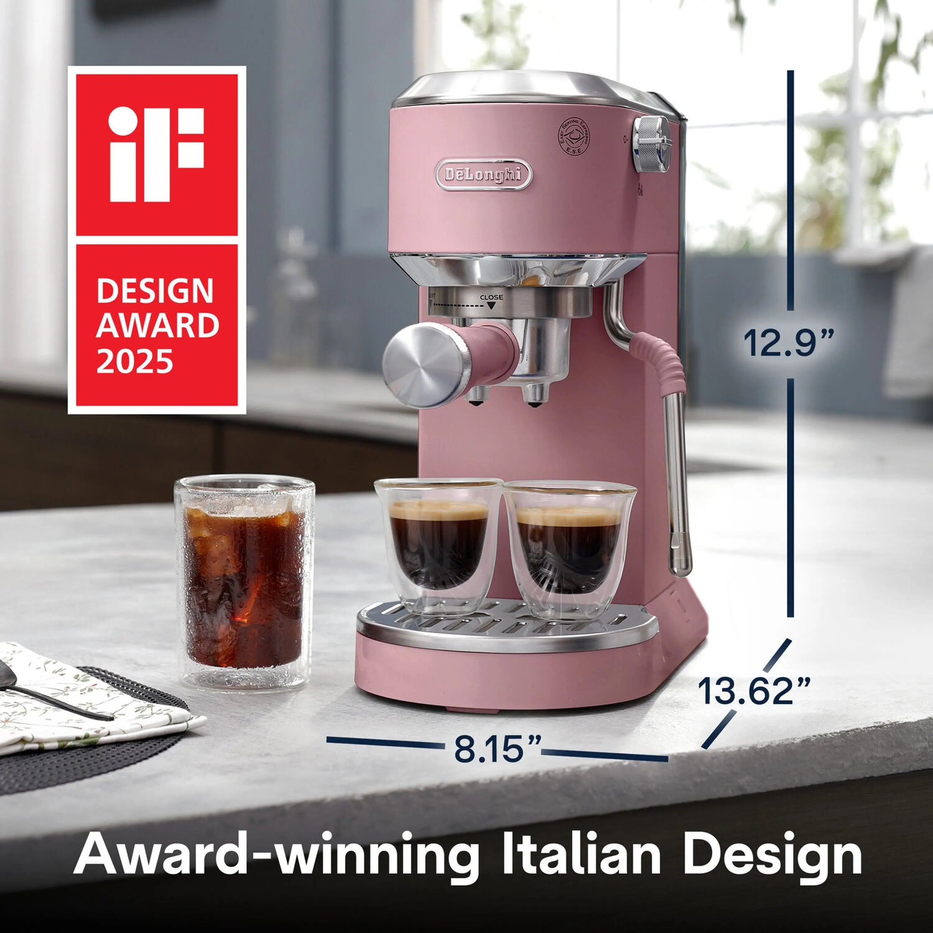 Pink De'Longhi pump espresso machine on countertop with two cups and frothing wand