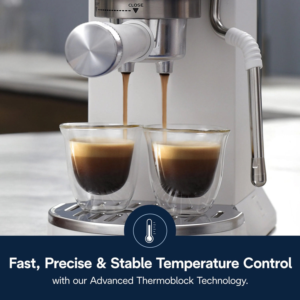 De'Longhi espresso machine double-pouring into two cups from dual spouts