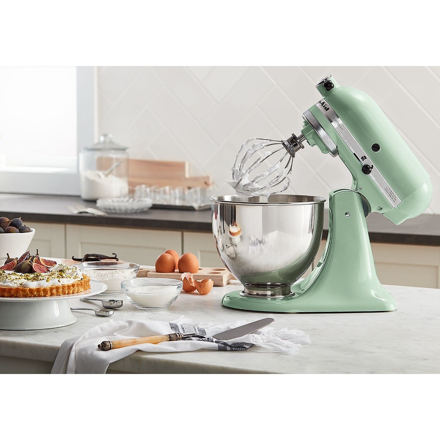 Pistachio tilt-head stand mixer with stainless bowl and wire beater