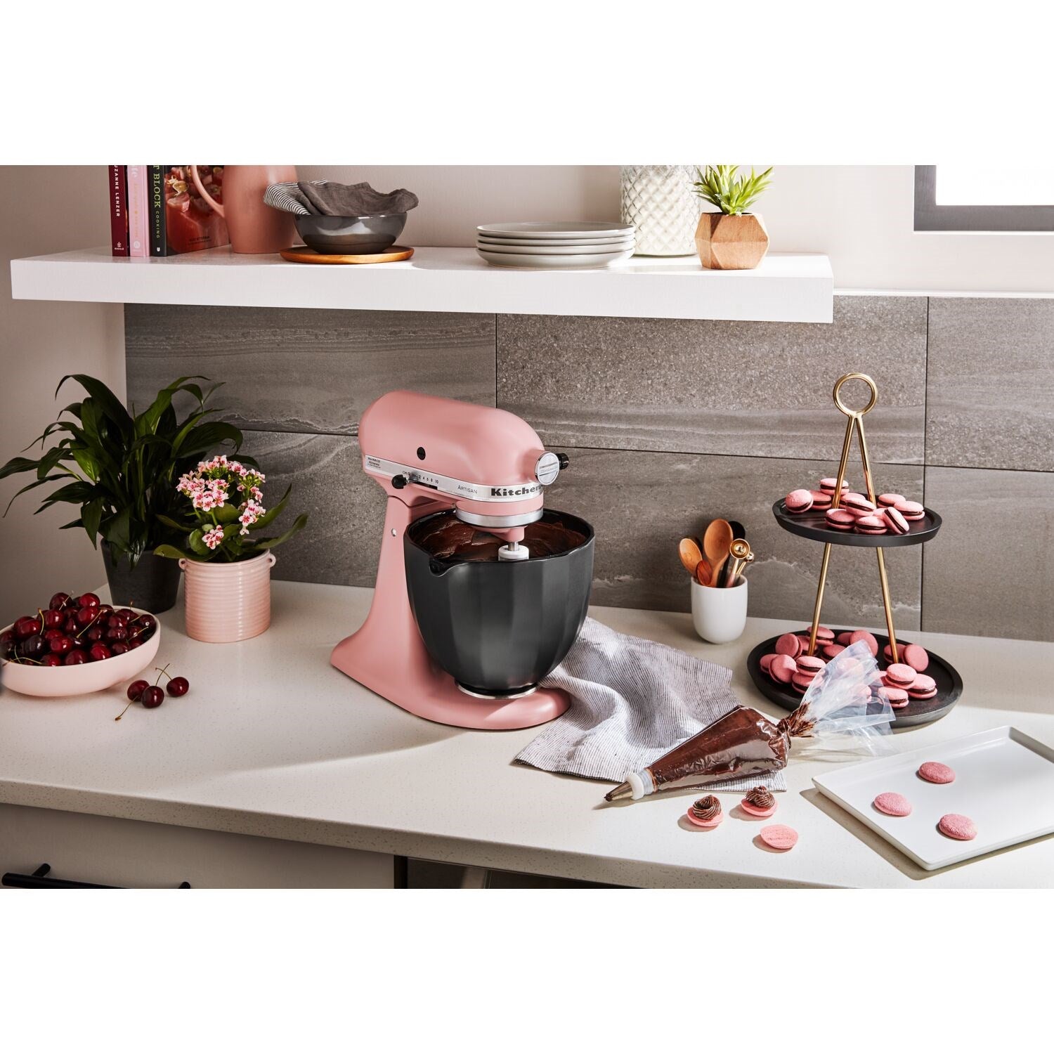 Black ceramic mixing bowl attached to stand mixer; glossy finish